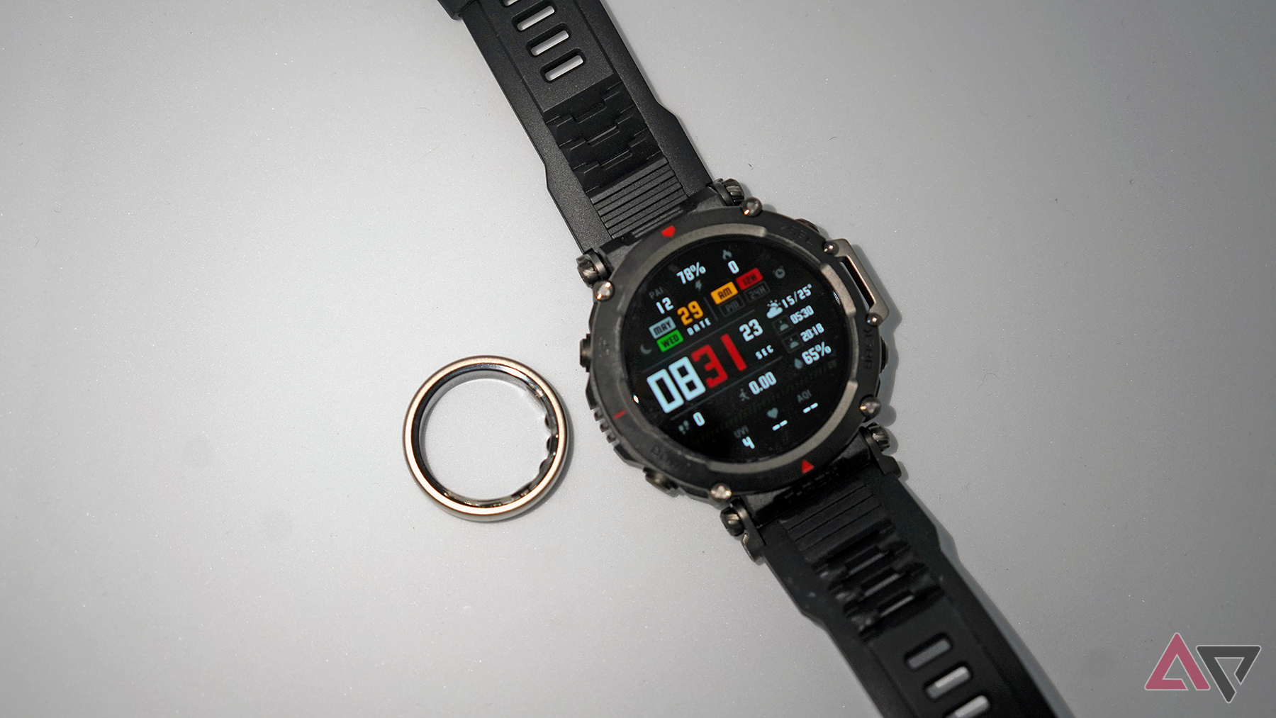 Helio Smart Ring ring next to Amazfit watch