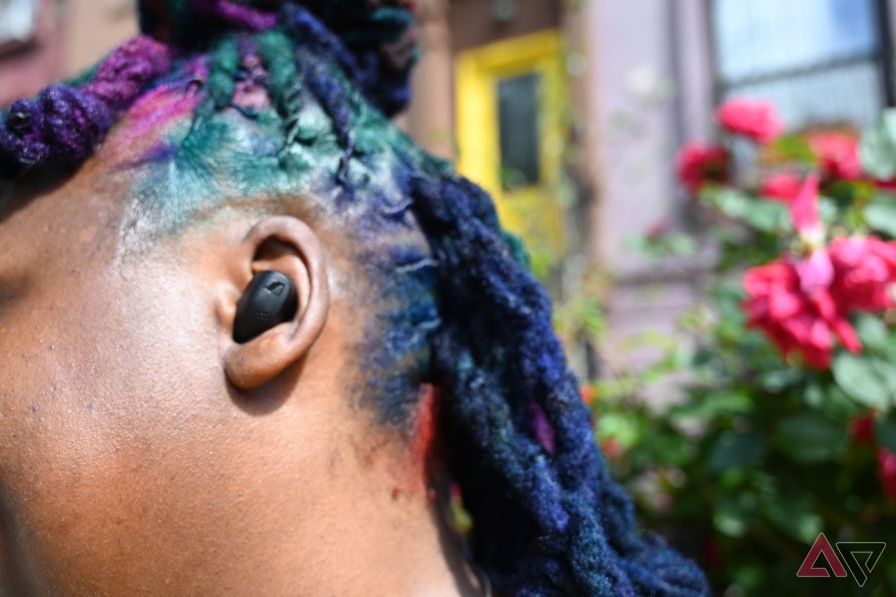 -Close-up of African-American woman wearing Sennheiser Accentum True Wireless