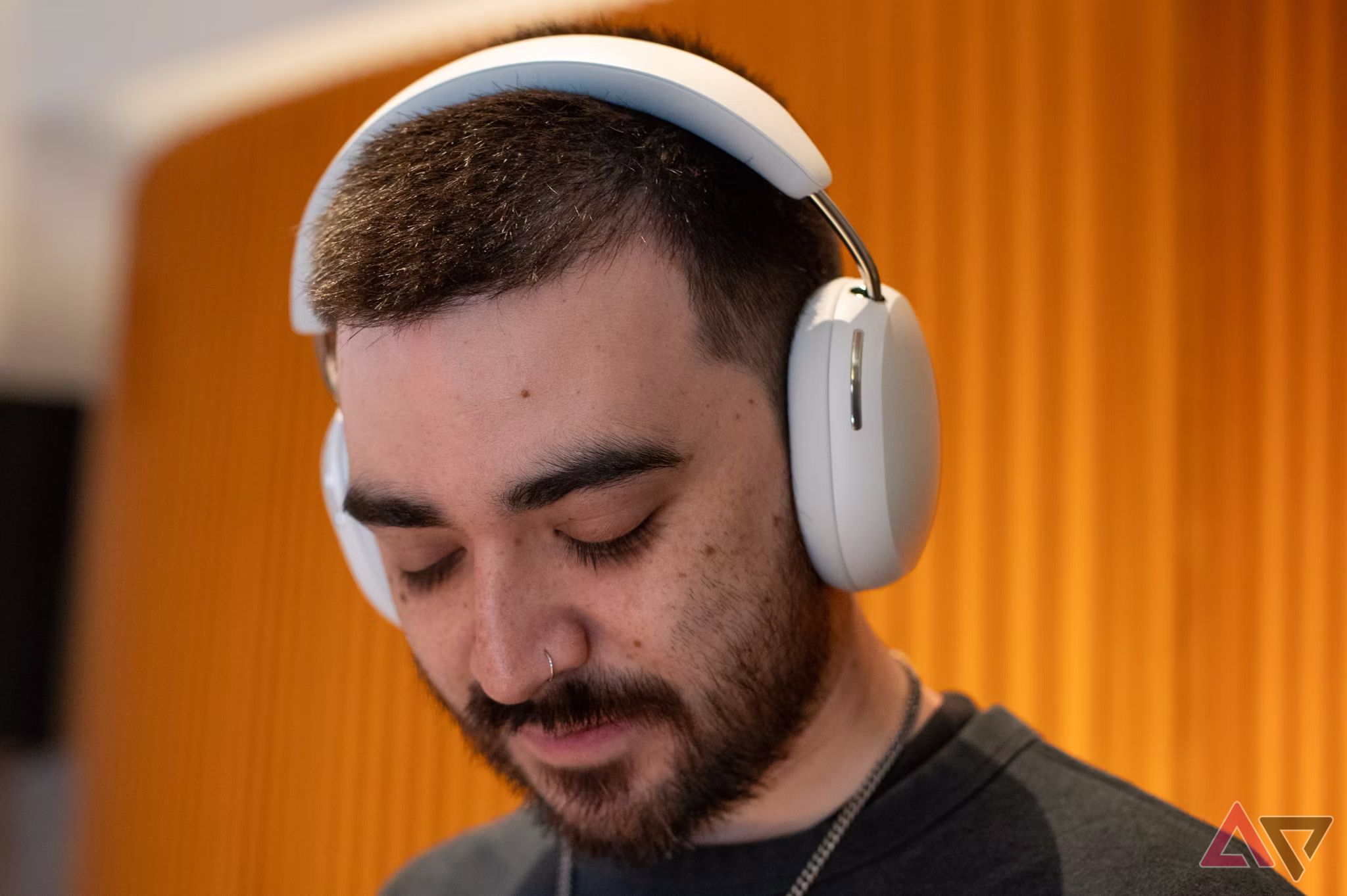 The Sonos Ace in White color on a person's head. 