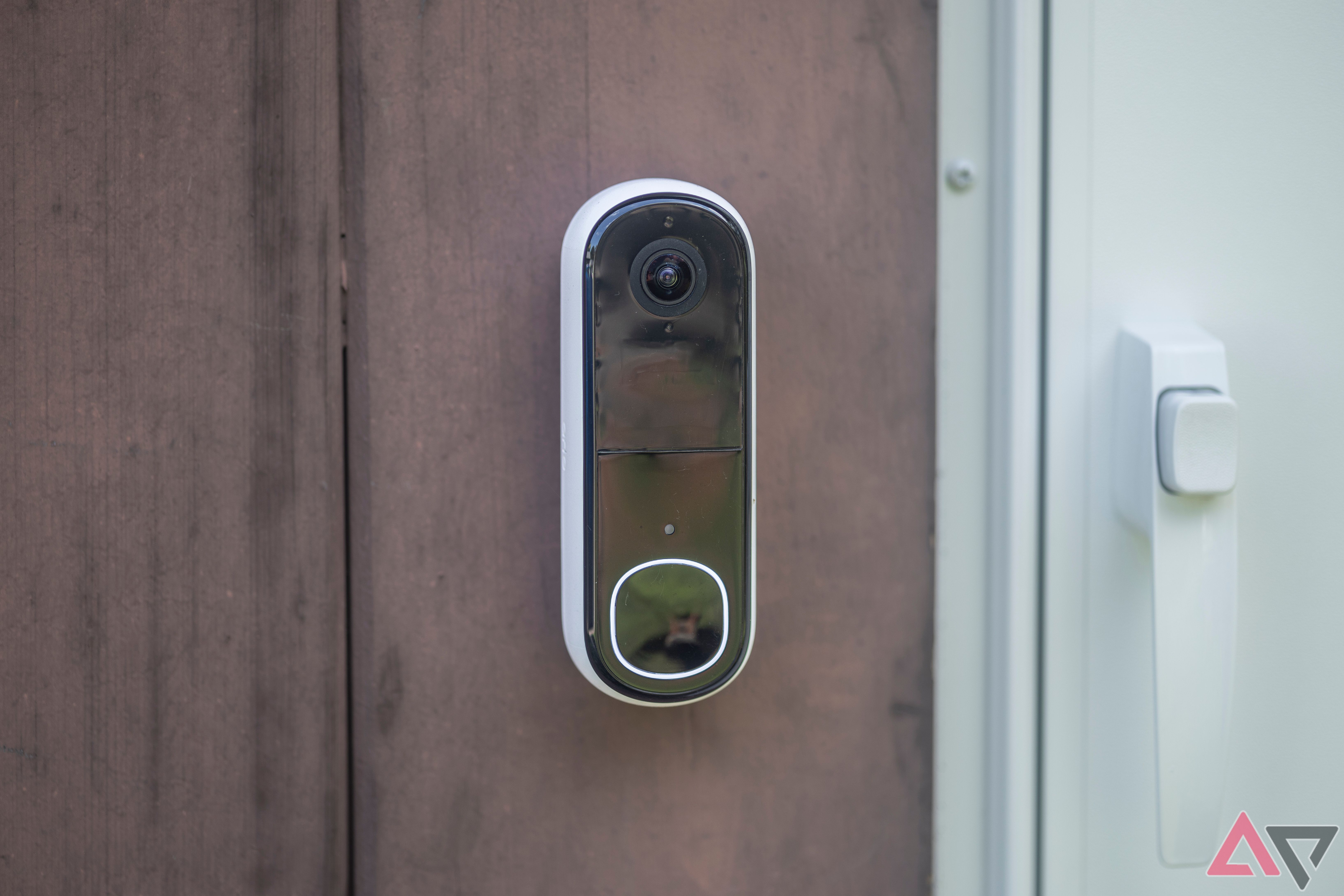 Arlo Video Doorbell (2nd Gen, 2K) mounted on house by white door