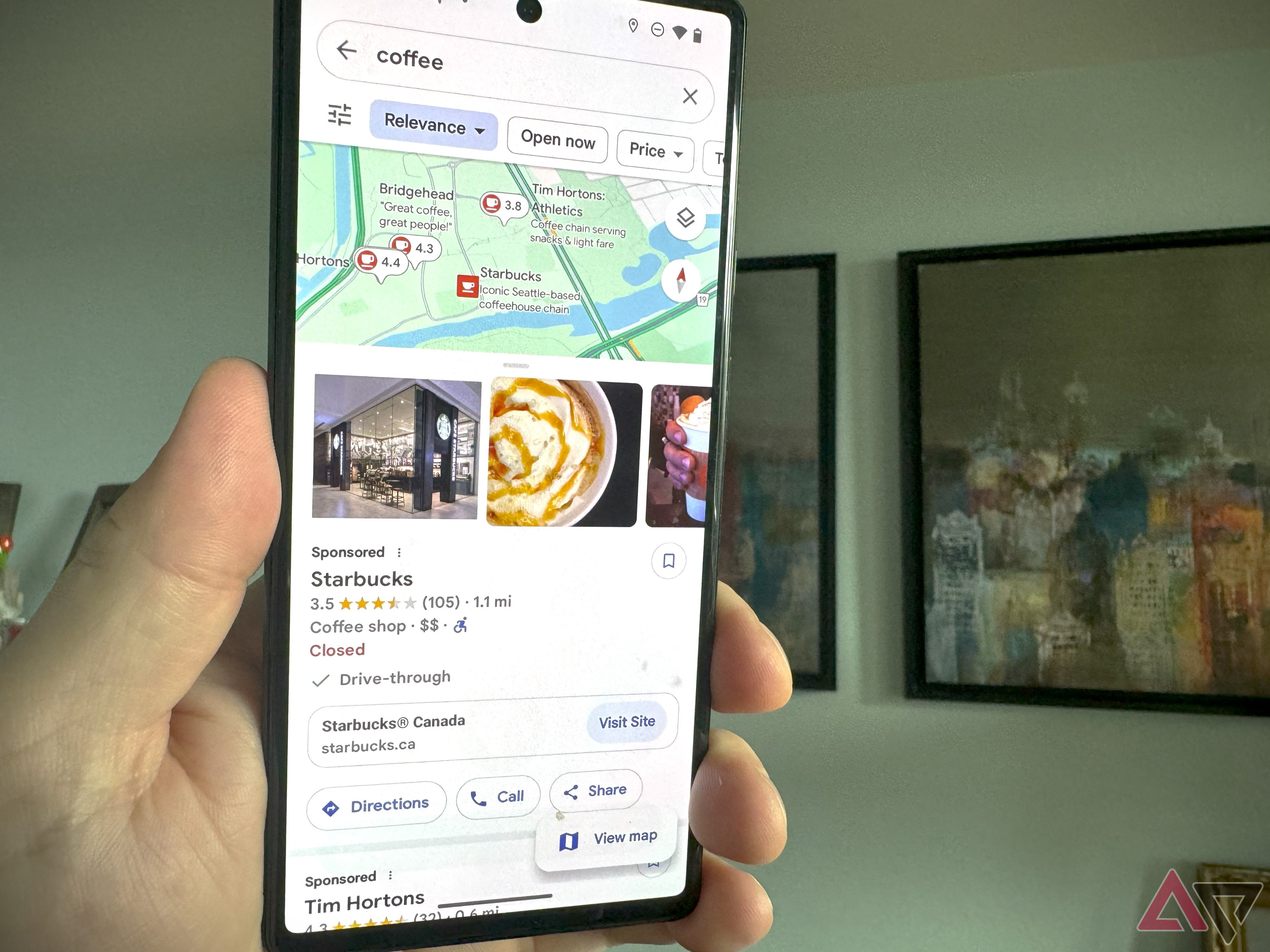 A hand holds a Pixel 6 with Google Maps suggest places showing.