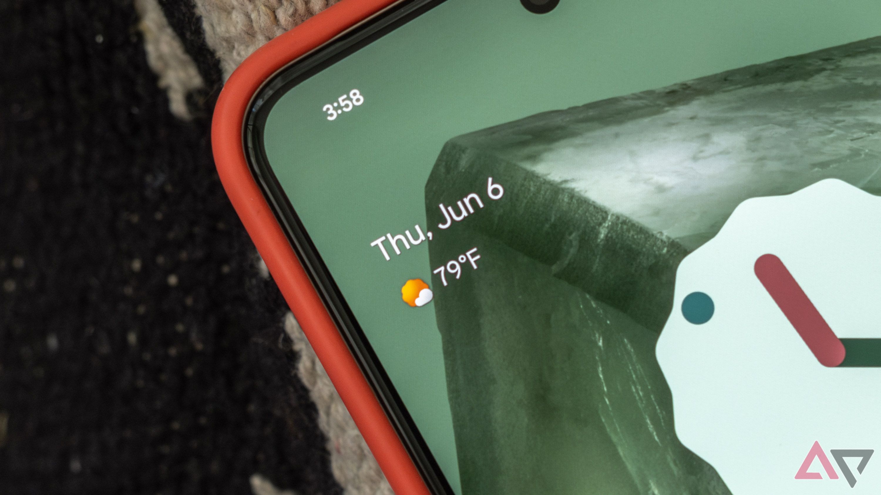A close-up view of a weather widget on a phone screen