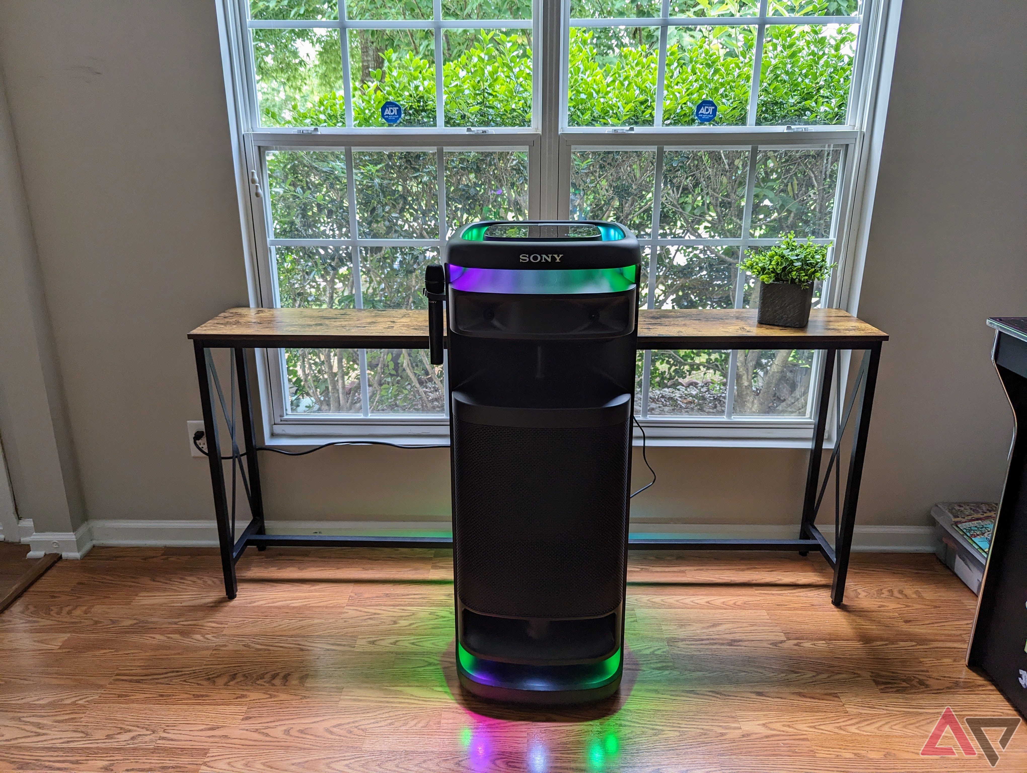 Sony Ult Power 10 tower with microphone in stand and purple/ green lightshow