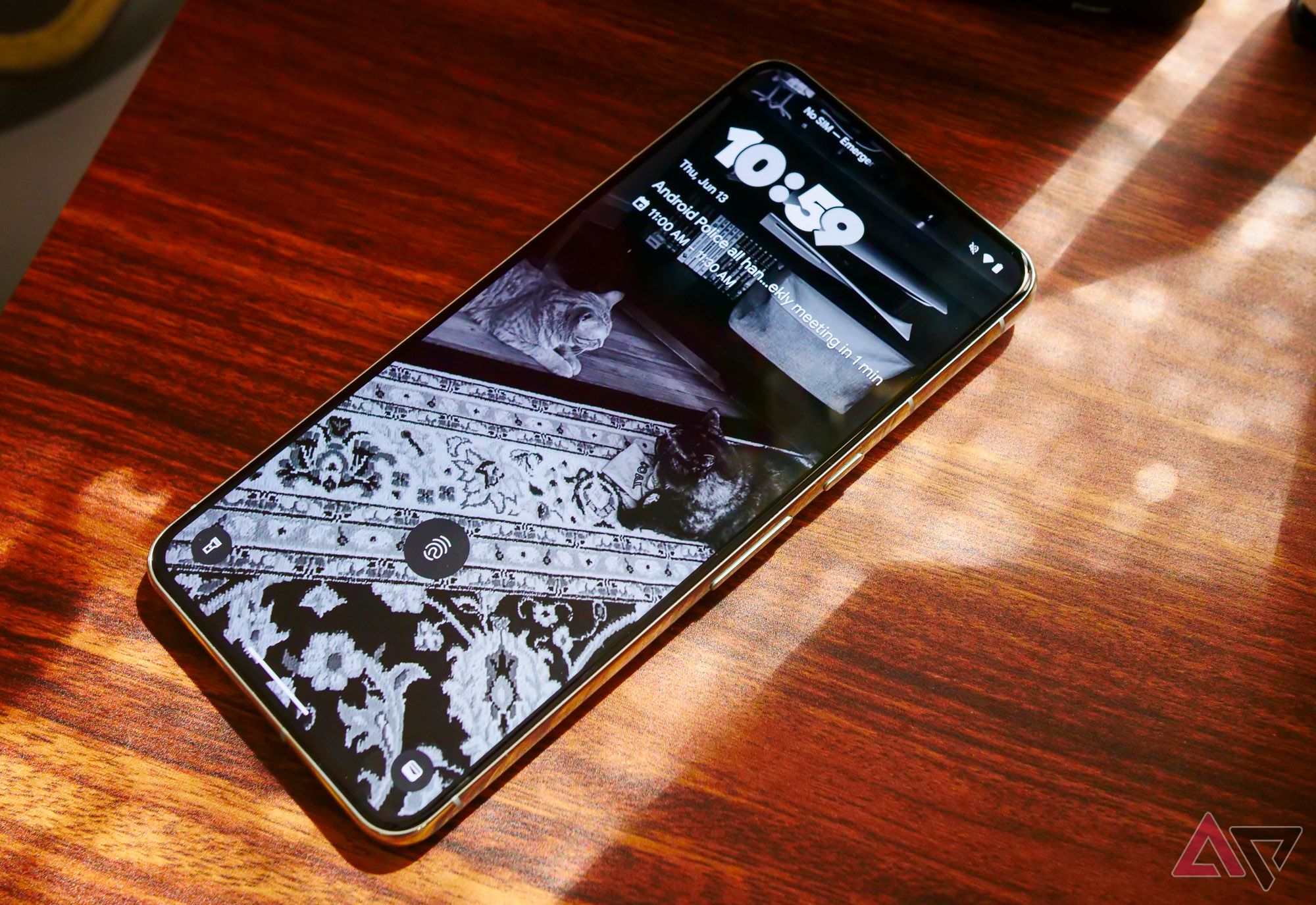 The Pixel 8 Pro lying on a desk with a lock screen shown.