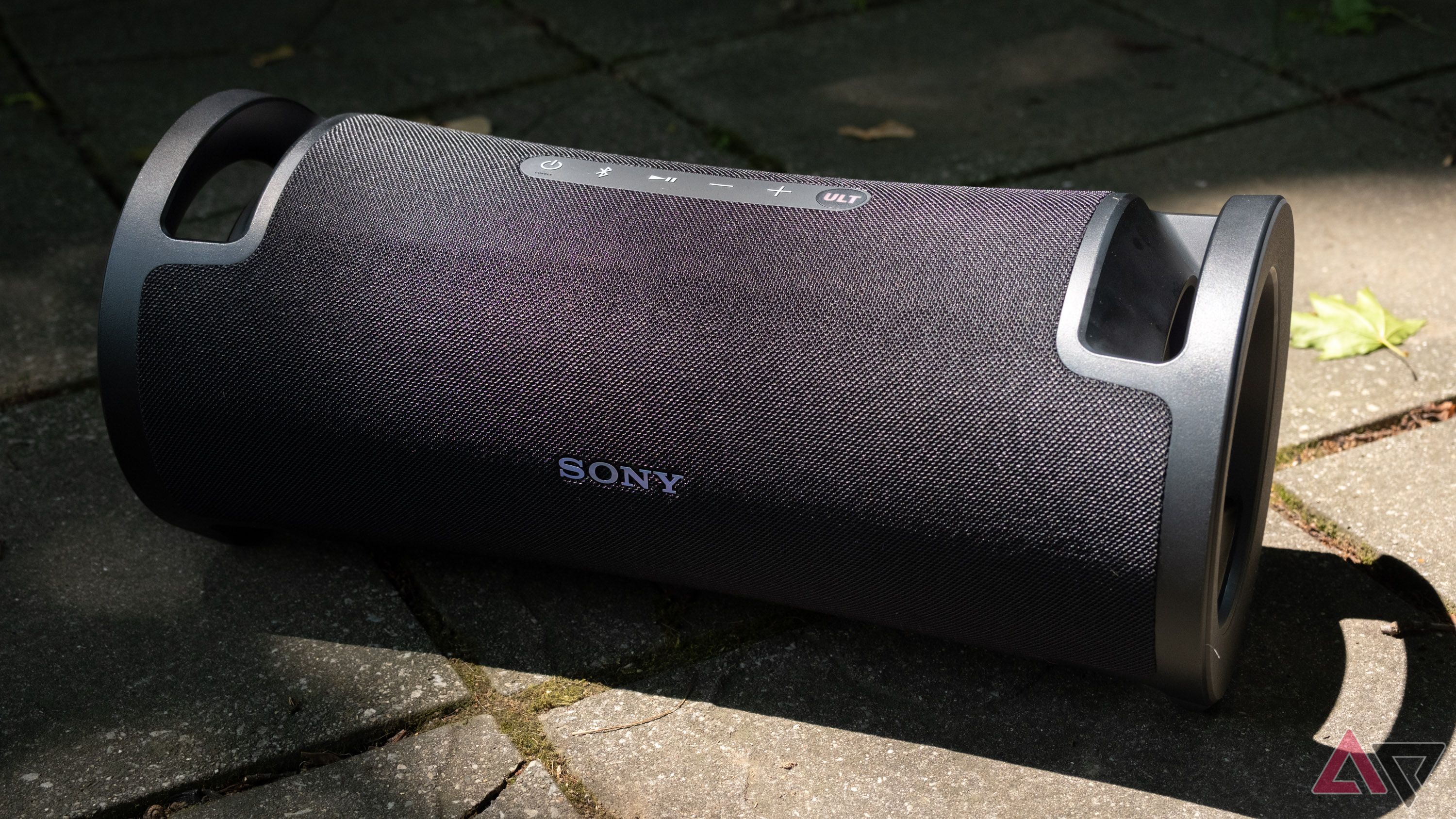 The Sony Ult Field 7 speaker sitting on a stone patio