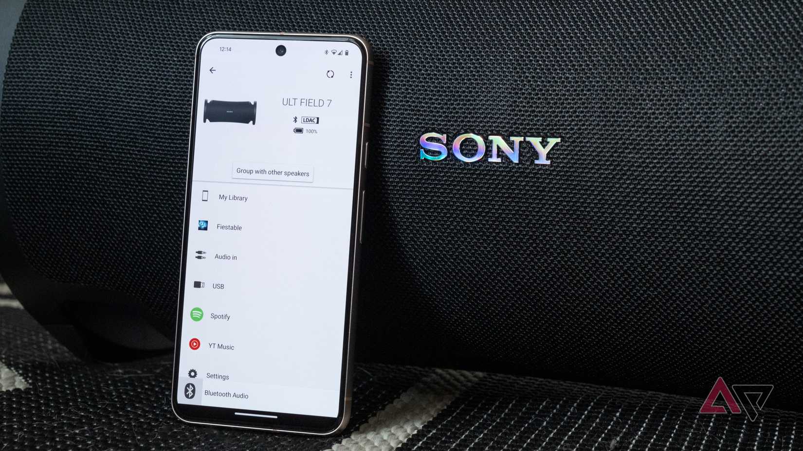 Sony's Companion on a phone tilted against Sony speaker