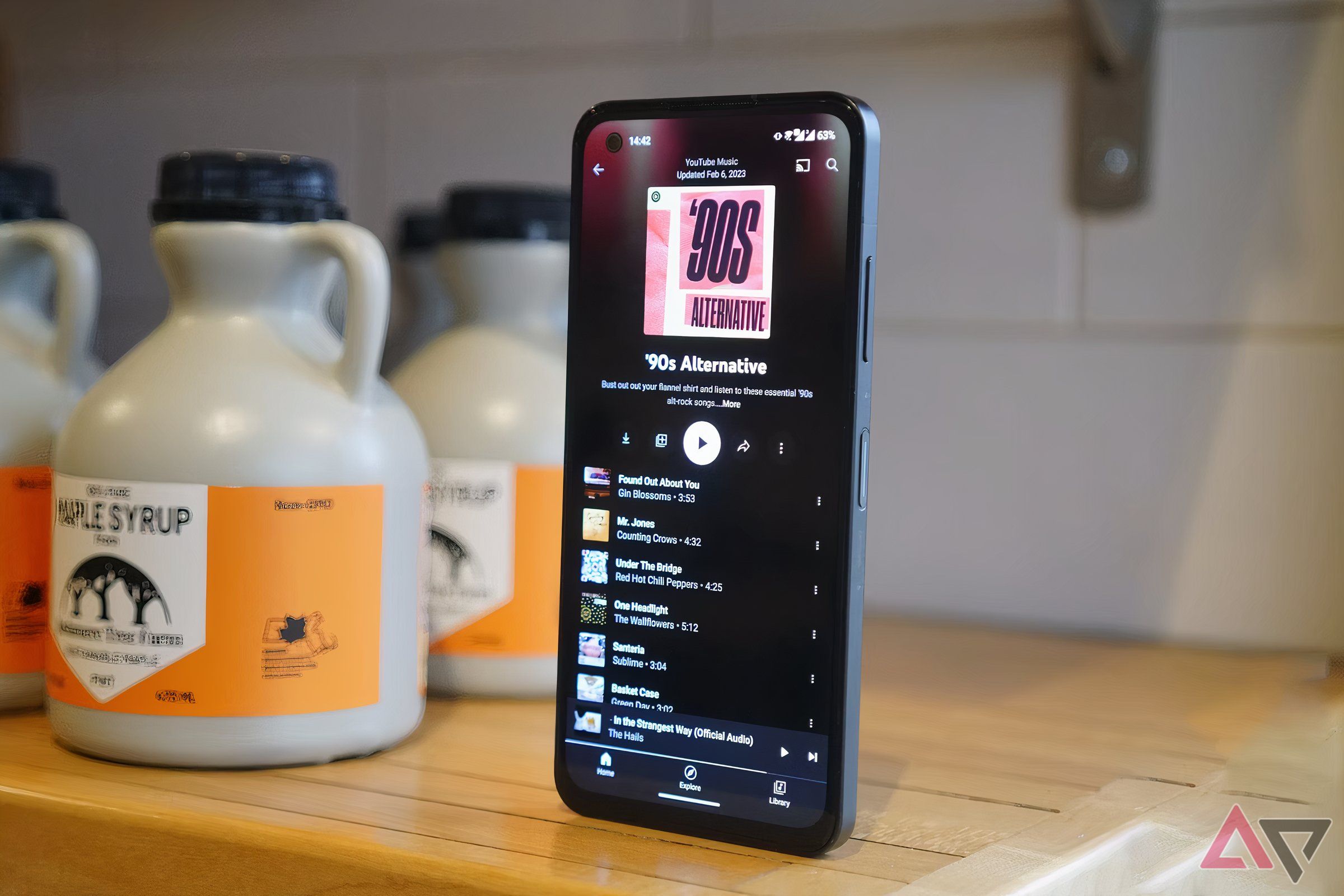 A phone's display showing a YouTube Music playlist.