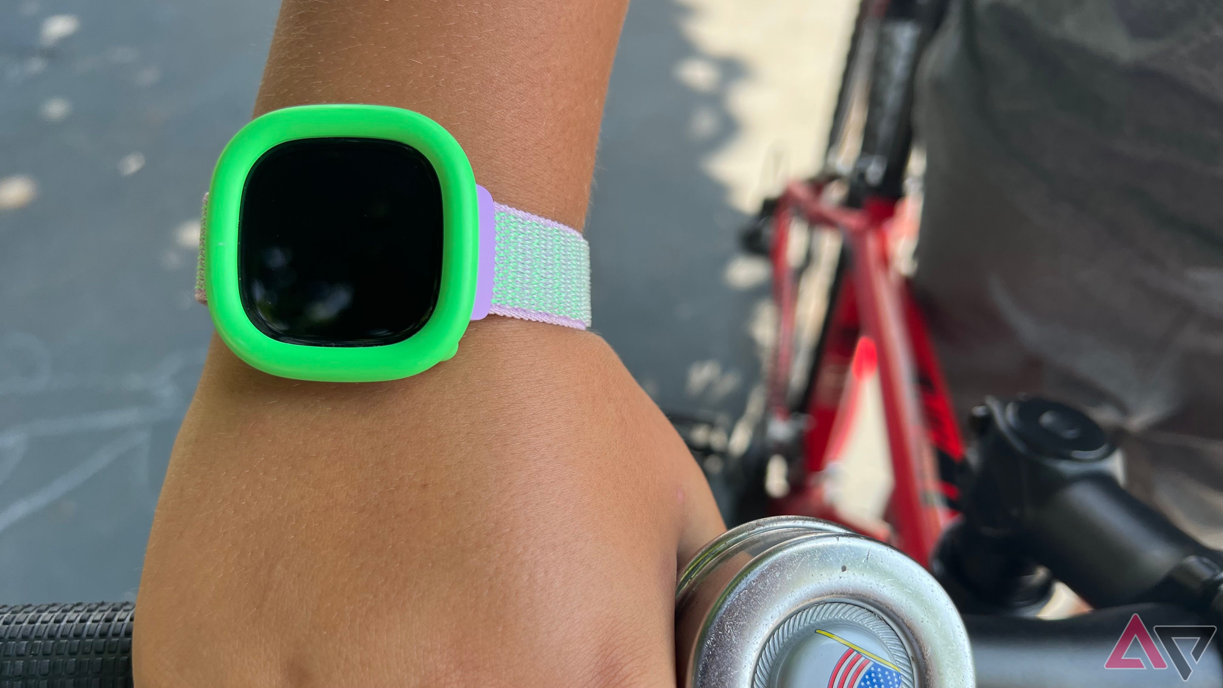 Person wearing Fitbit Ace LTE while riding bike