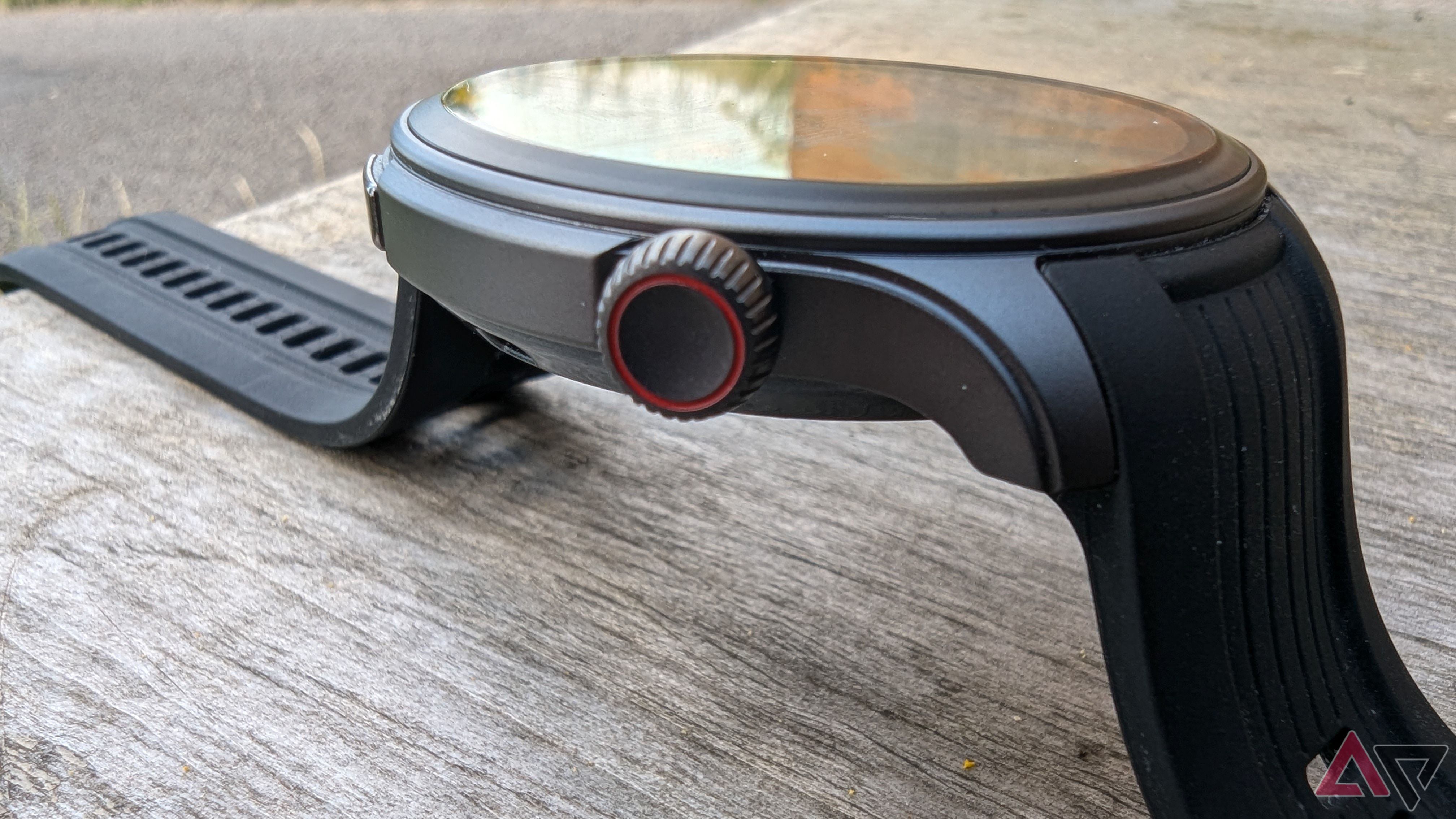 Side view of Amazfit Balance smartwatch in Midnight color on bench showing Digital Crown