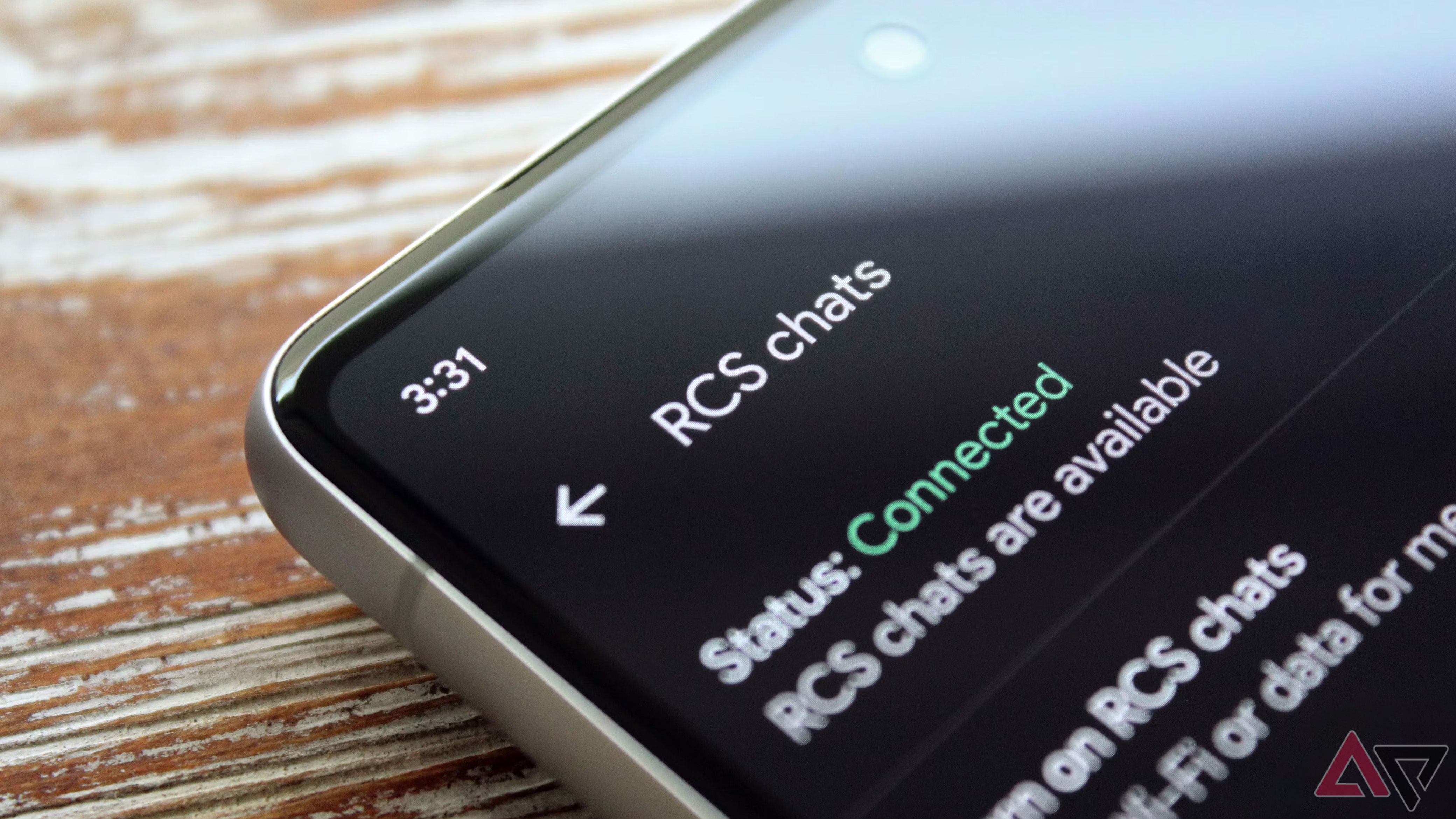 Closeup of a phone showing RCS chats settings on its screen.