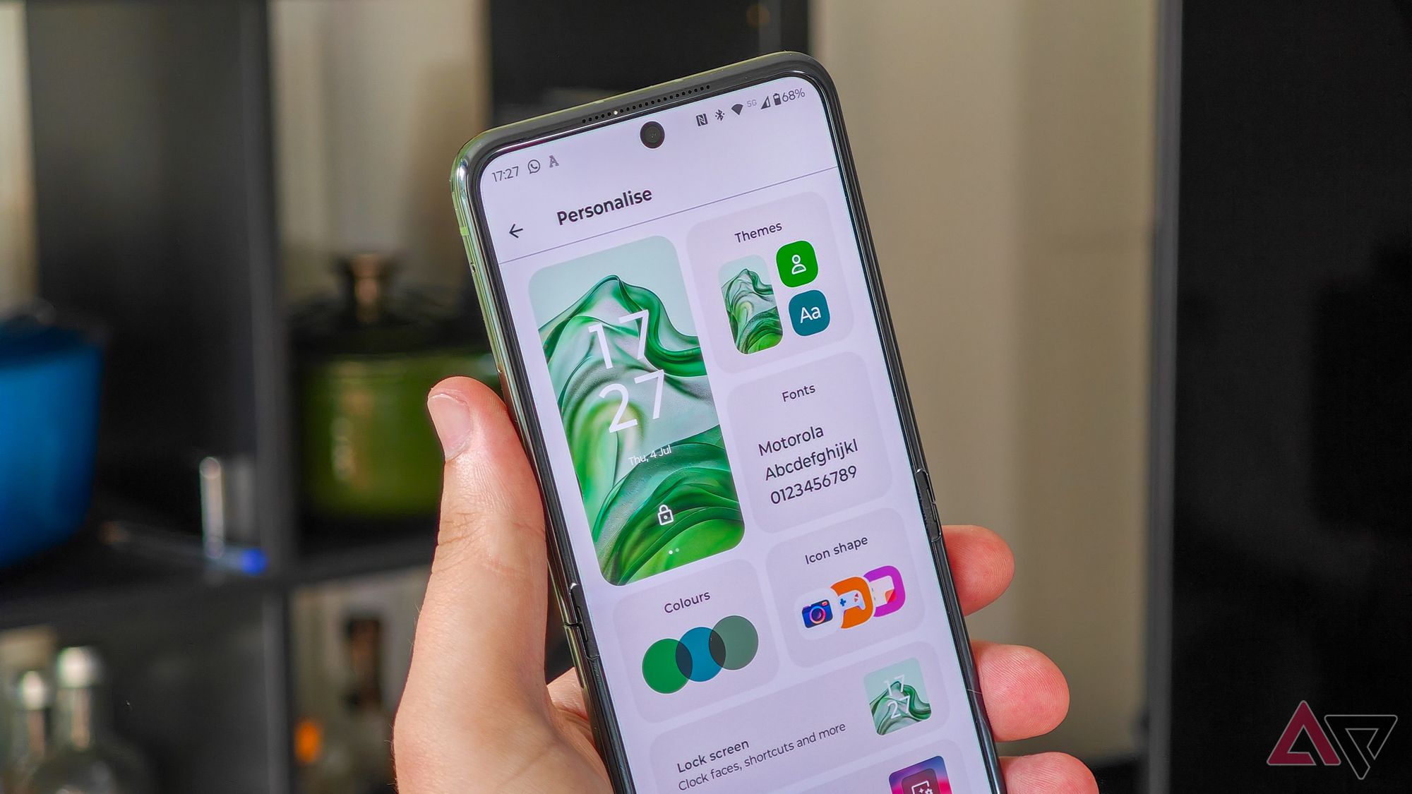 Motorola Razr+ 2024 open in someone's hand showing the Personalise settings menu