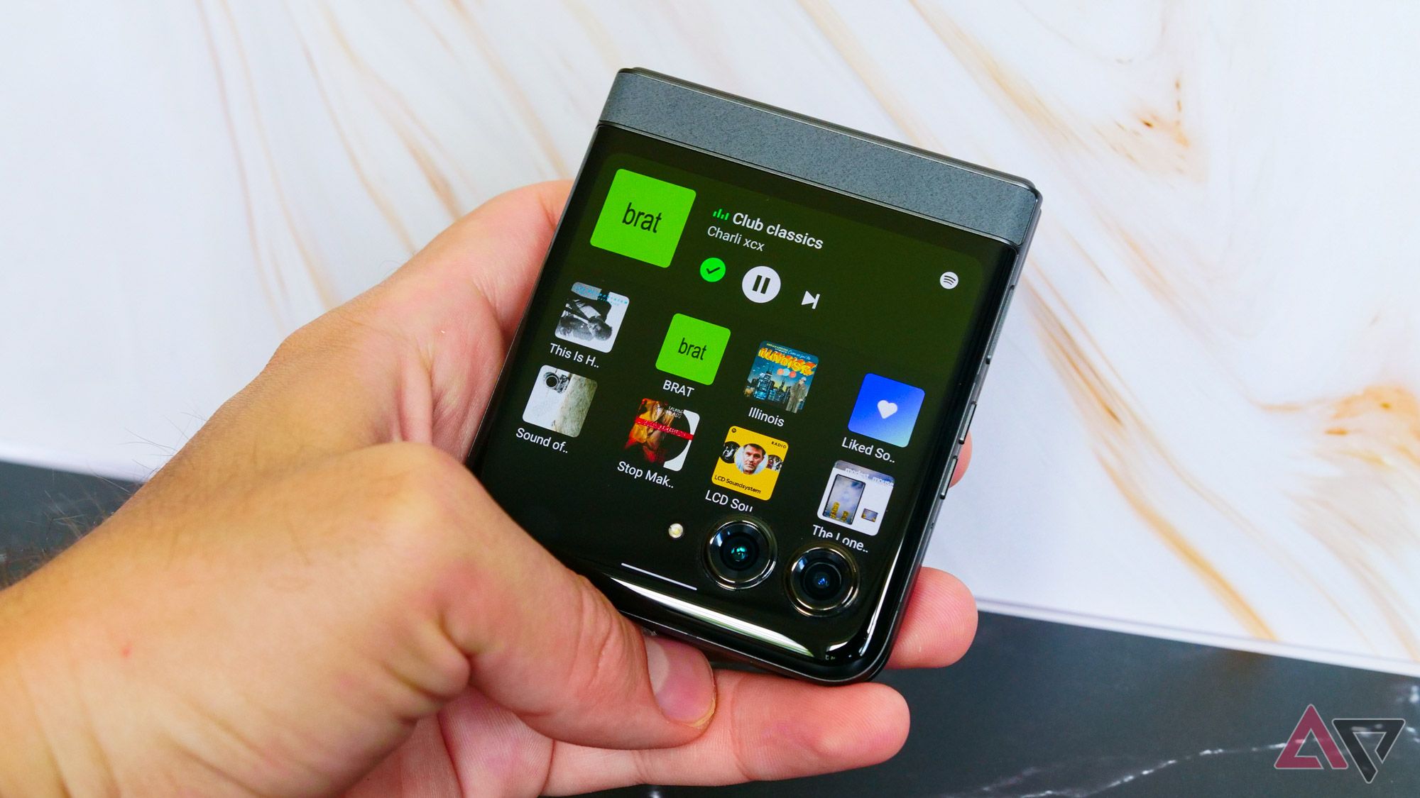 The Moto Razr 2024 playing music on its Spotify widget