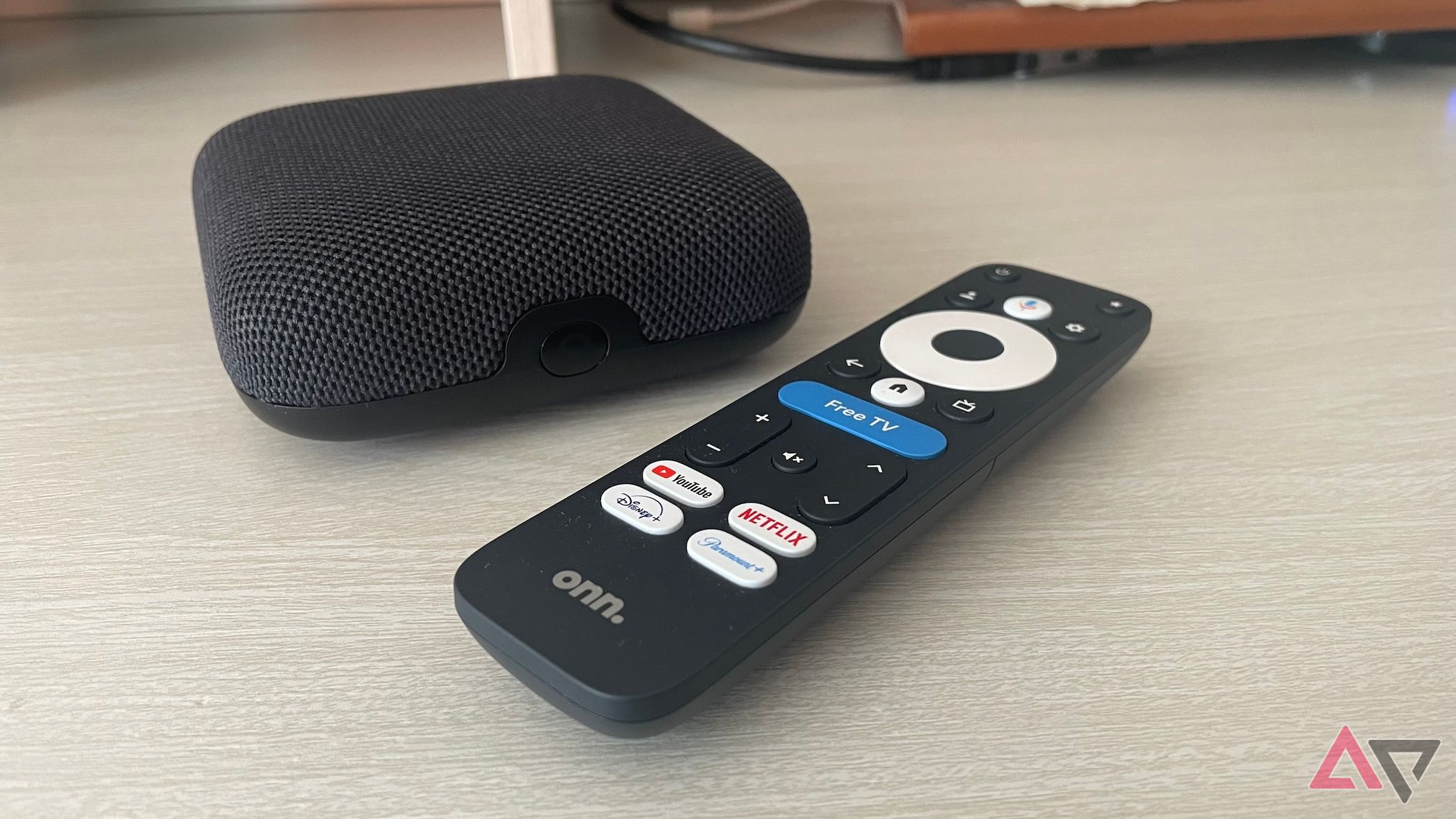 The Onn Google TV 4K Pro next to its remote