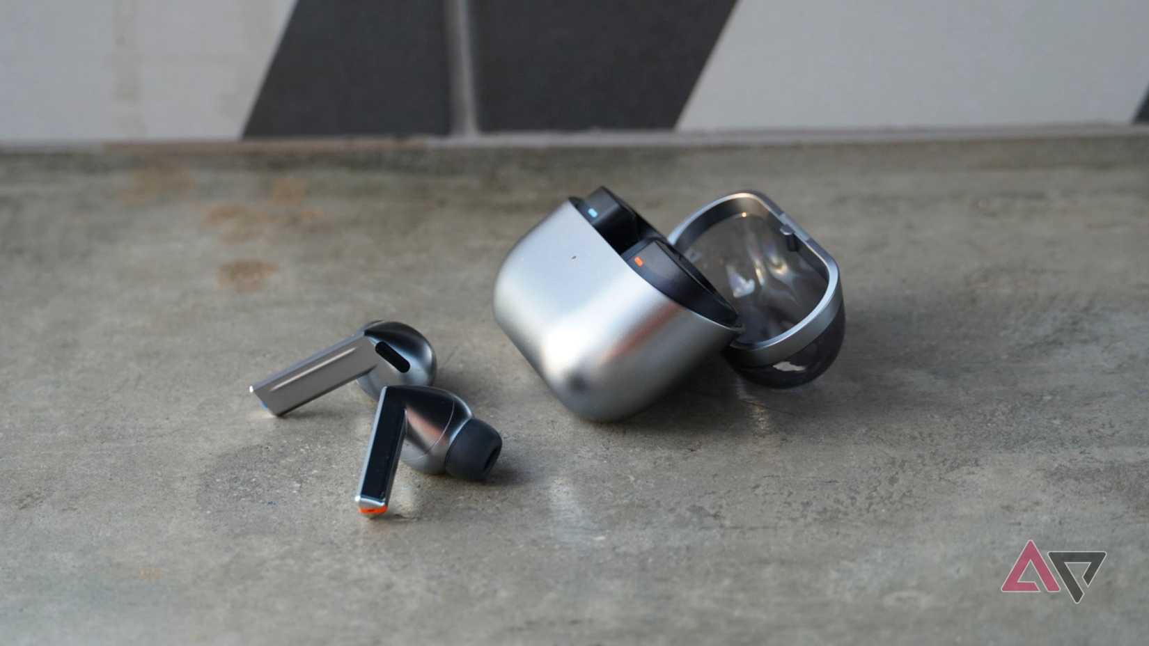 A side view of the Galaxy Buds 3 Pro with their case.