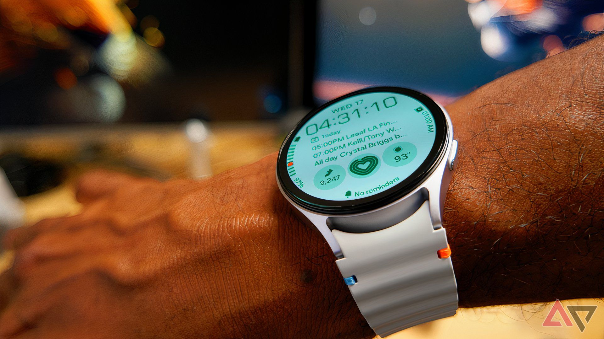 Samsung Galaxy Watch 7 on arm, showing home screen