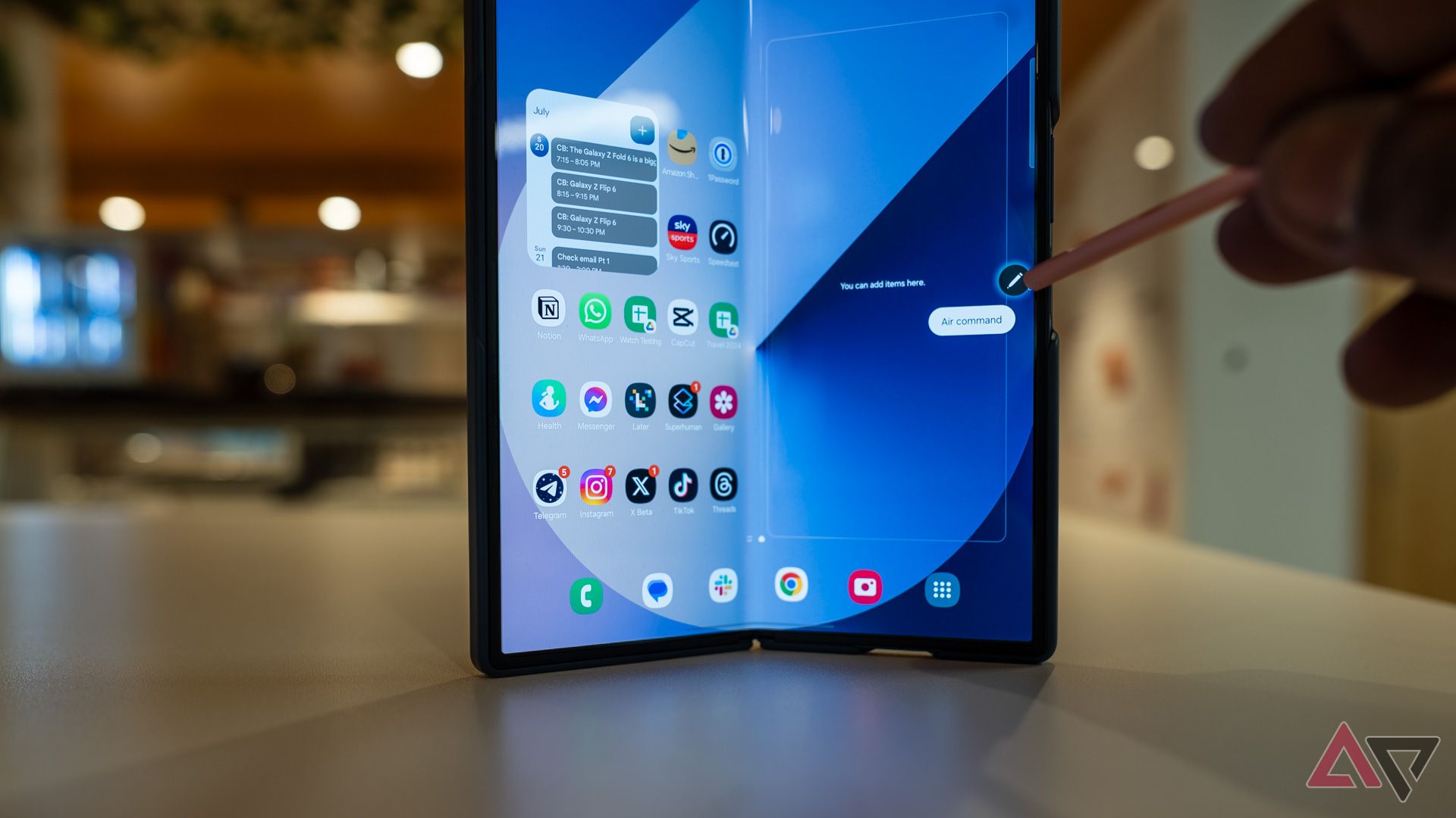 A person using an S Pen with a Samsung Galaxy Z Fold 6