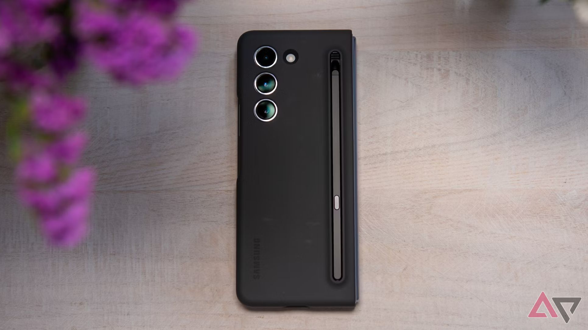 A photo of the Samsung Galaxy Z Fold 5 face down on a table, inside an S Pen case