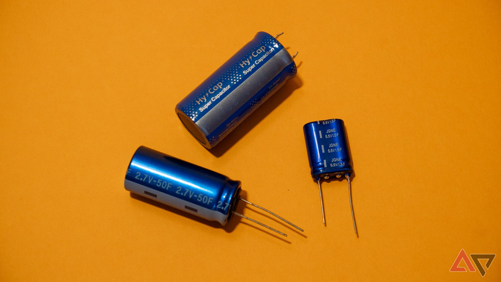 three-supercapacitors-blue-on-yellow-background