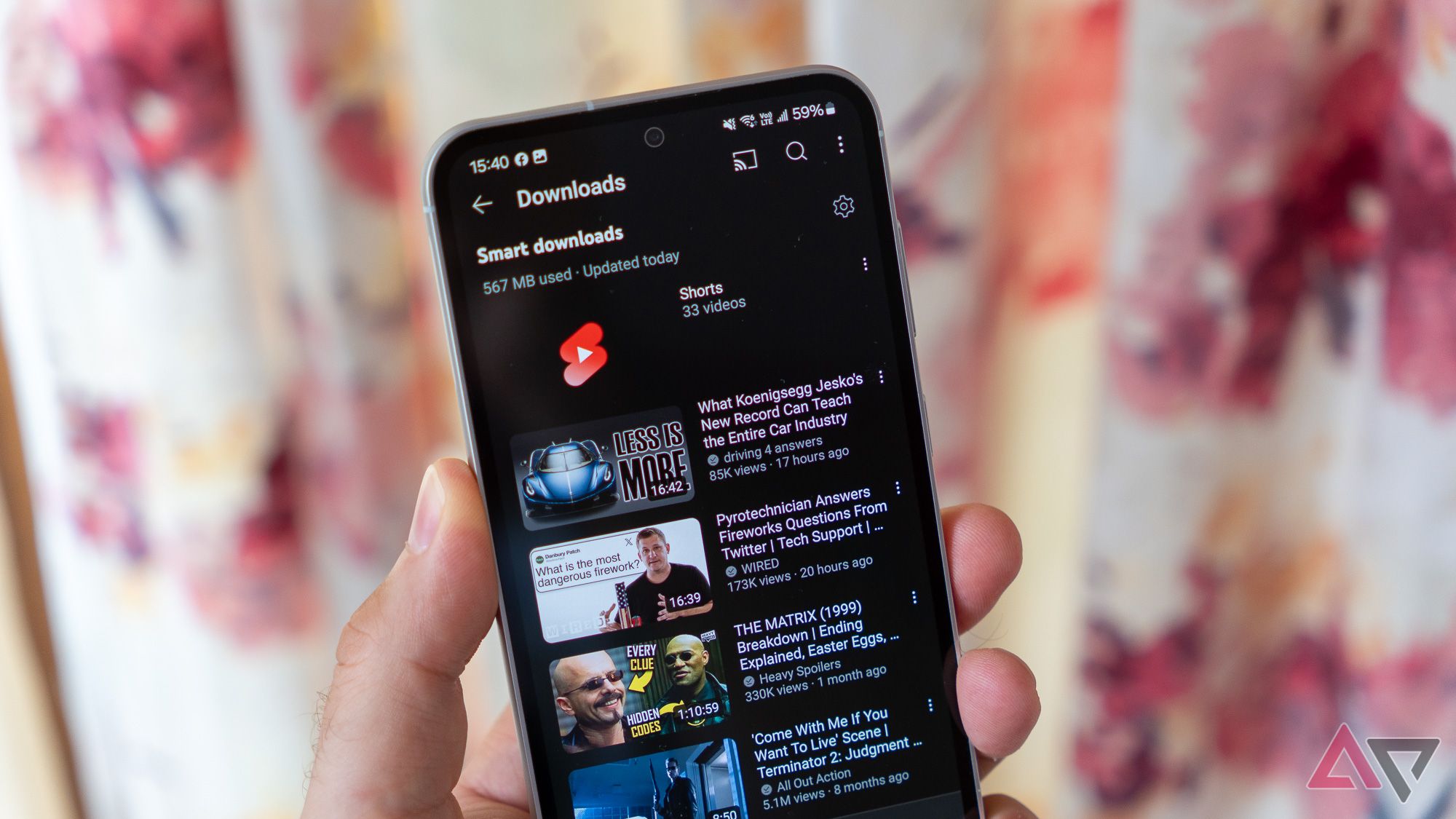 YouTube Premium Downloads Displayed On A Samsung Phone Held In Hand.