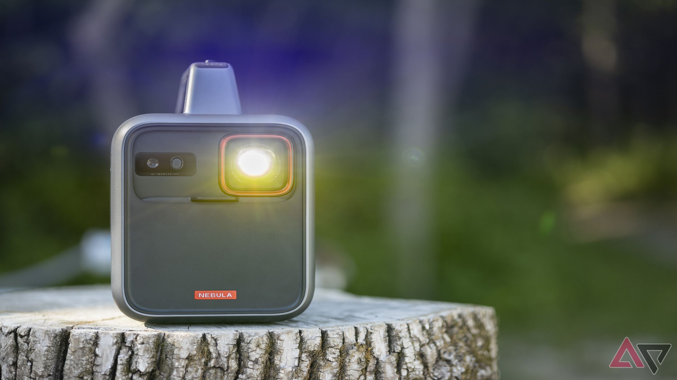 Anker Nebula Mars 3 portable projector outdoors with bulb on 