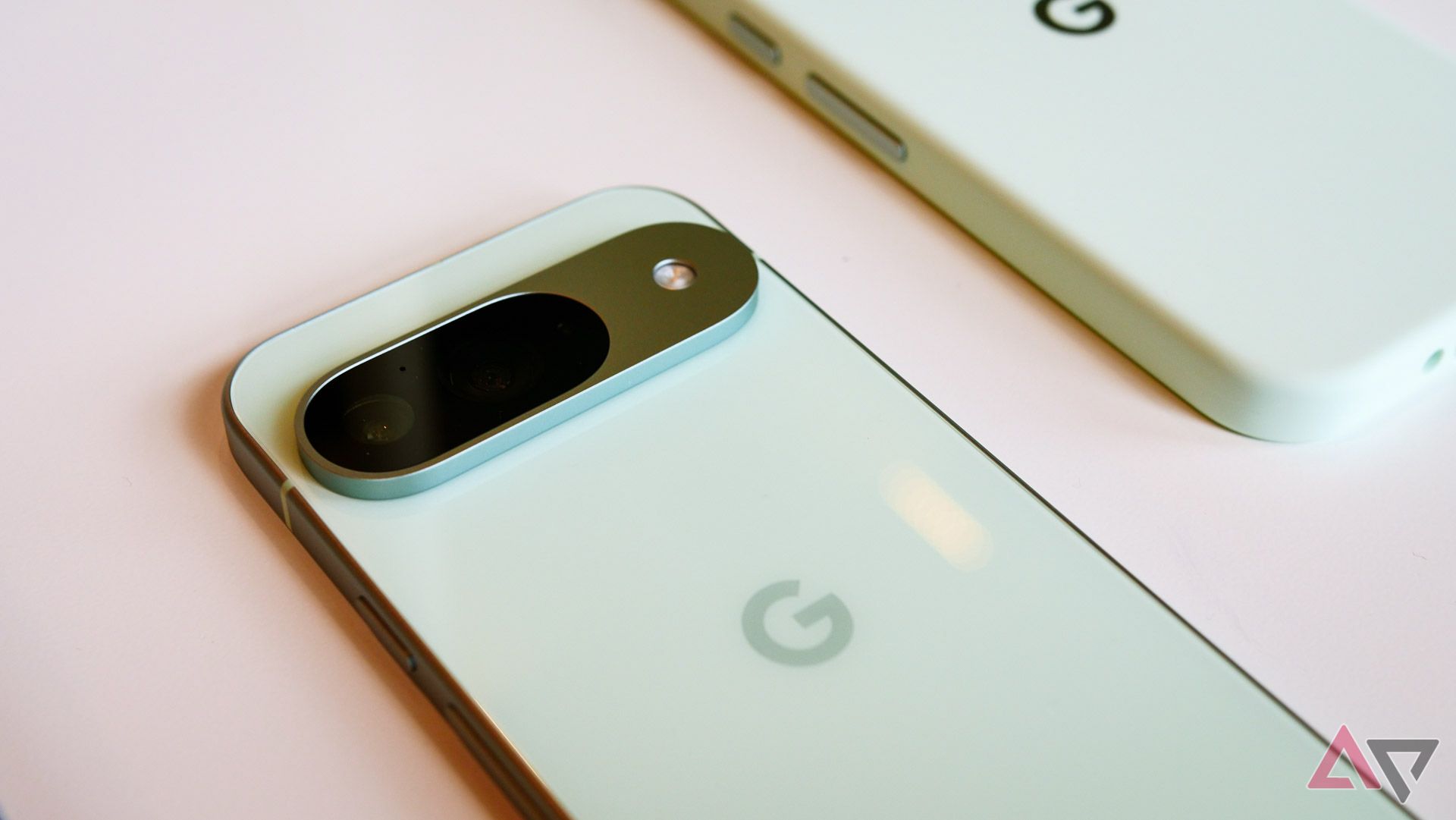 Google Pixel 9 in mint facedown on a table