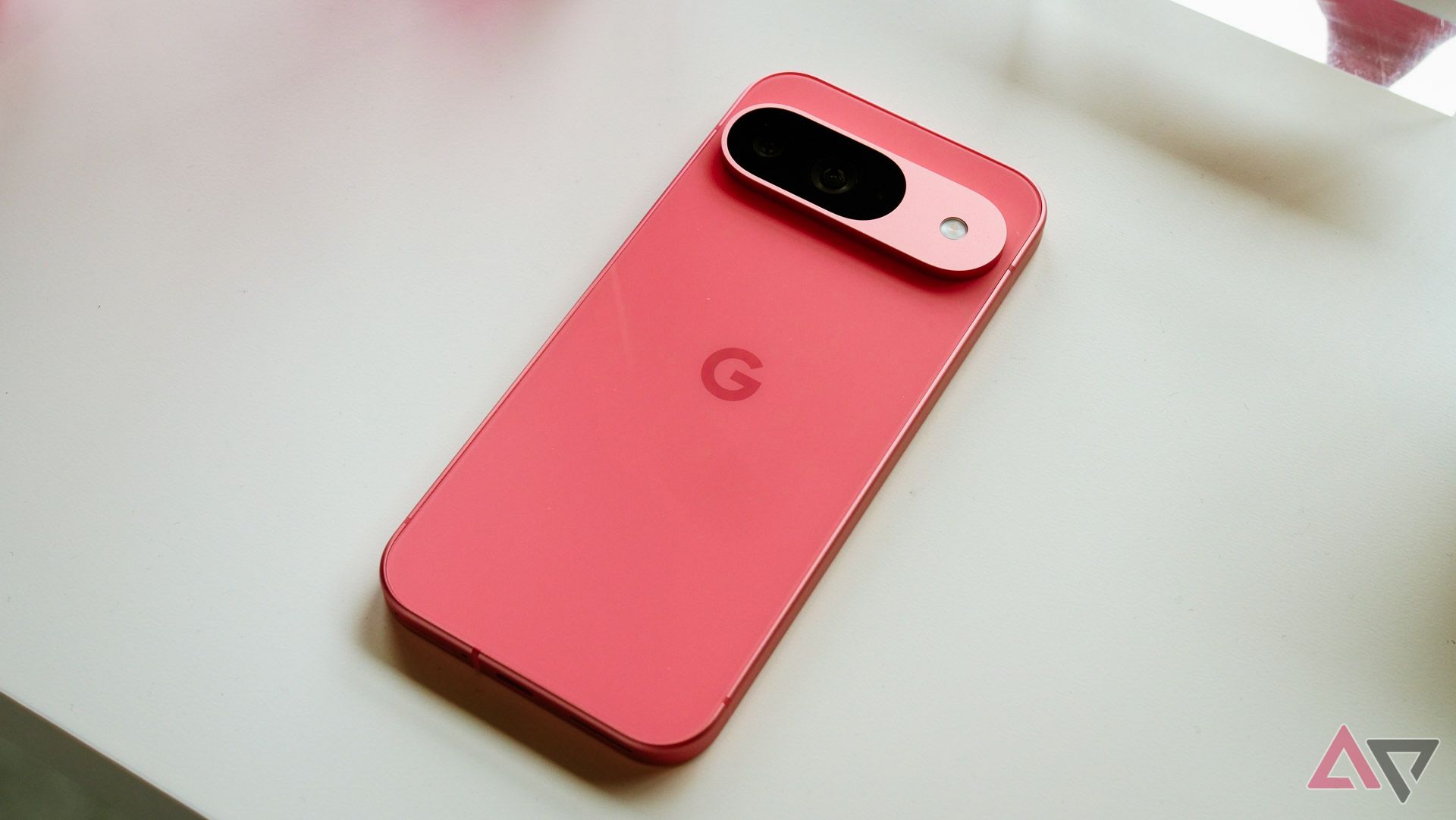 Pink Google Pixel 9 facedown on a table