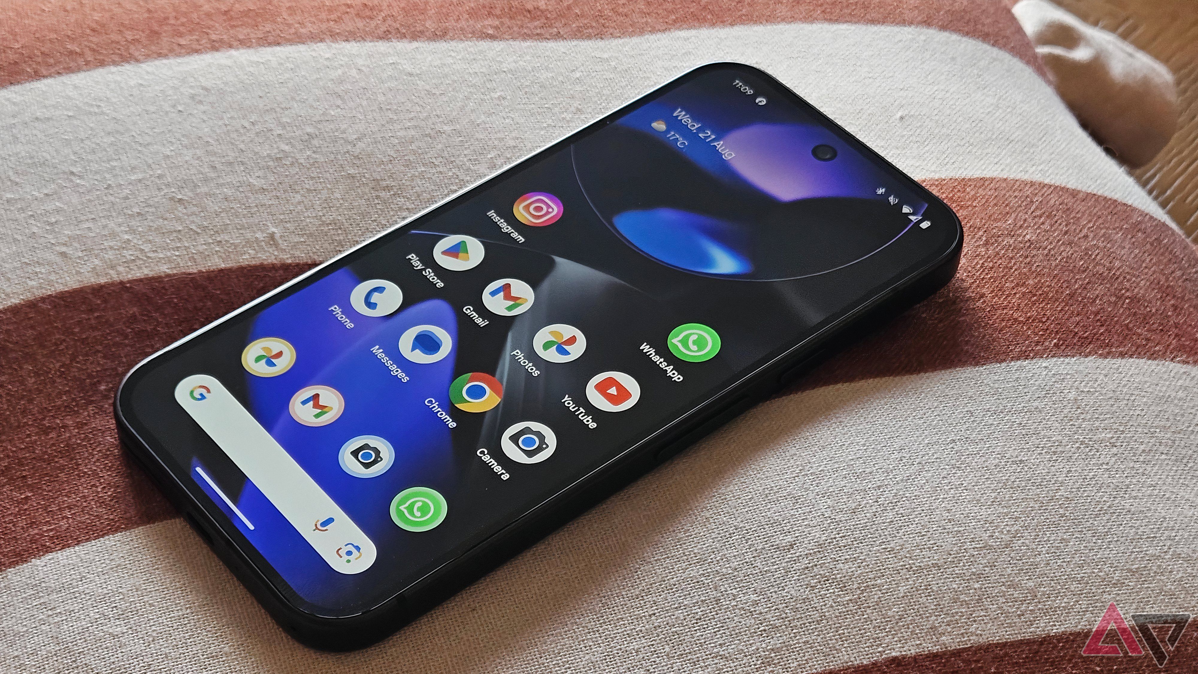 Google Pixel 9 lying in bed with screen on