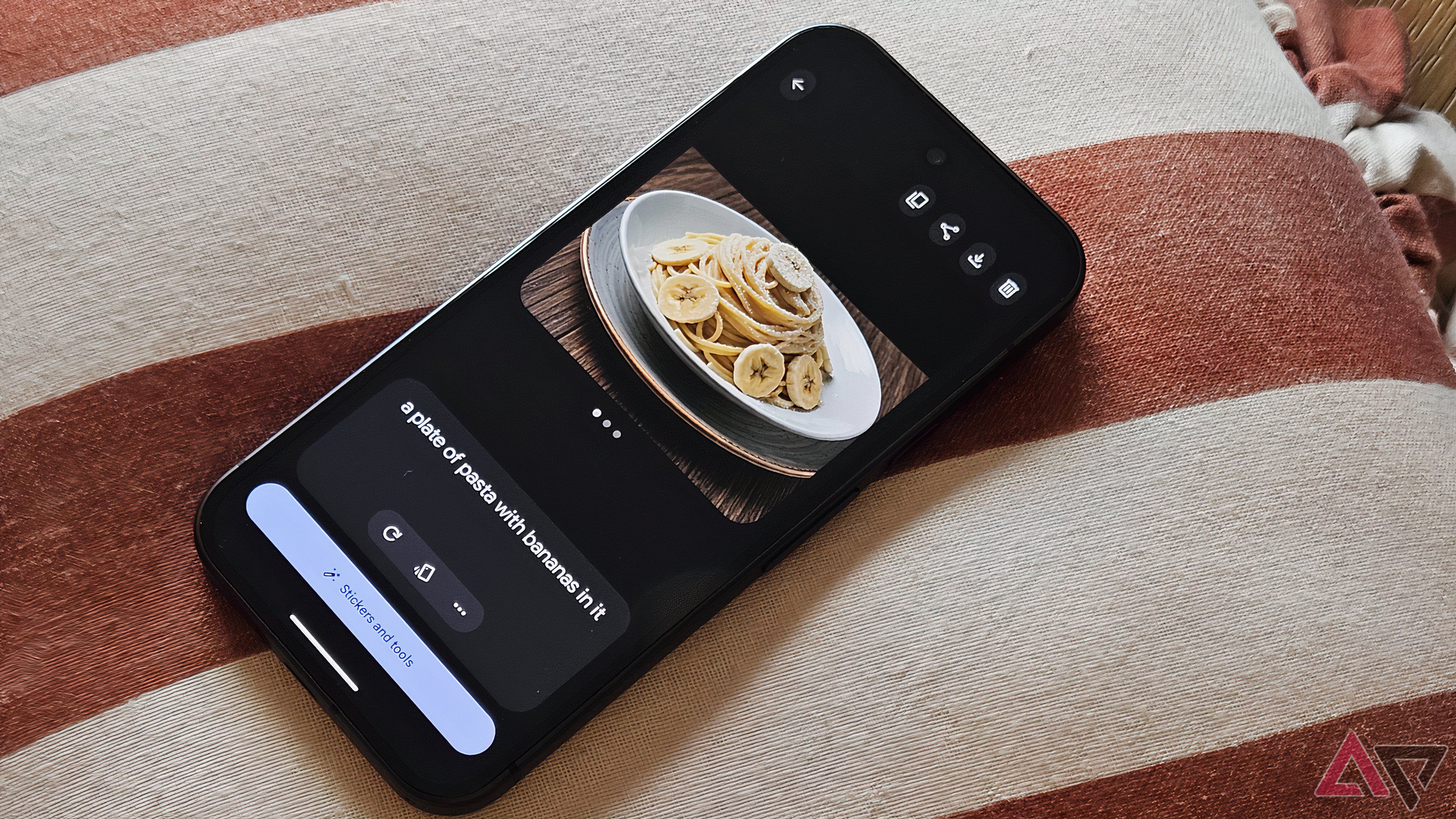 Google Pixel 9 on a striped surface with a plate of bananas on the screen