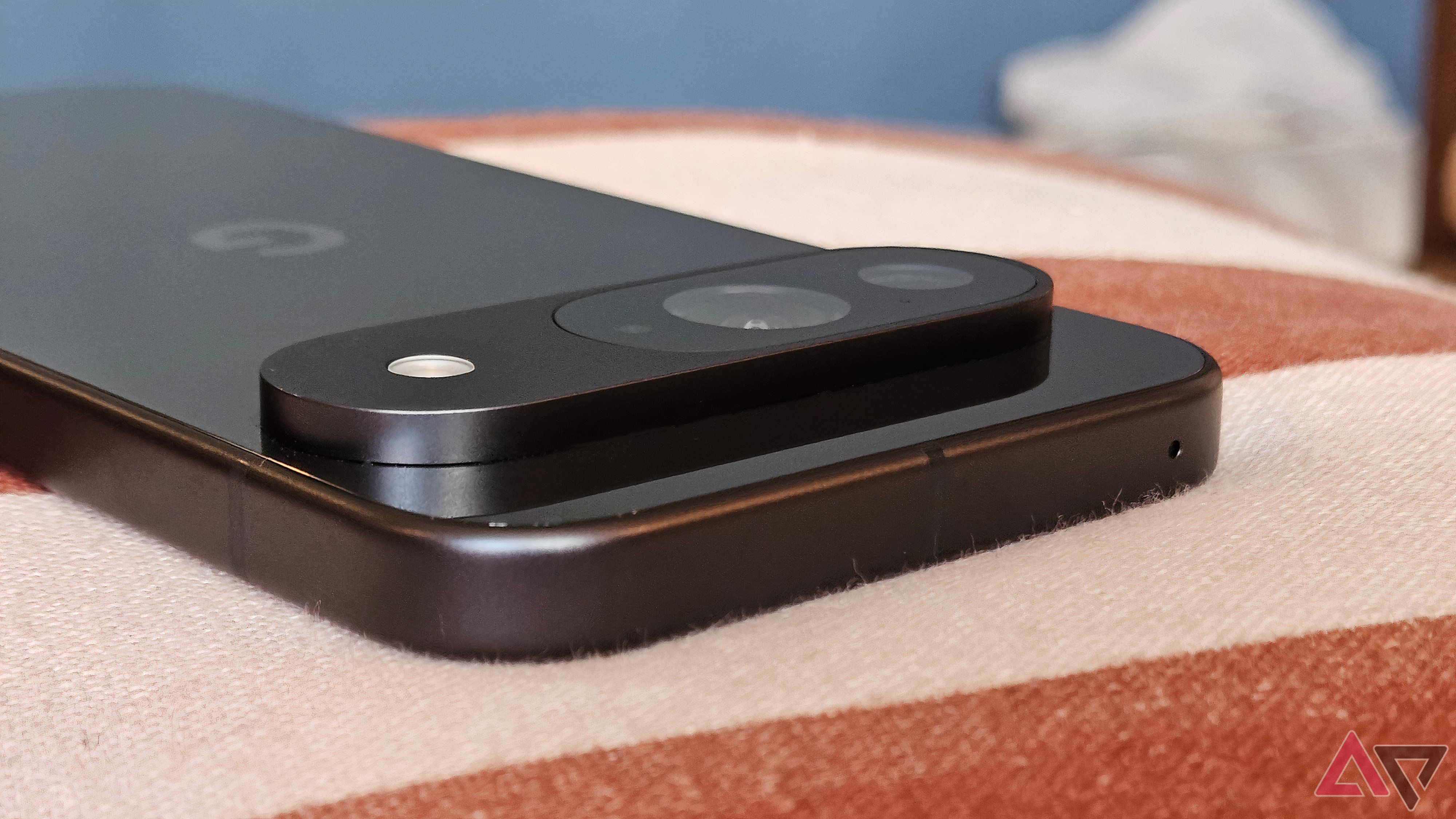 A close up of the Google Pixel 9 camera on a red and white table cloth