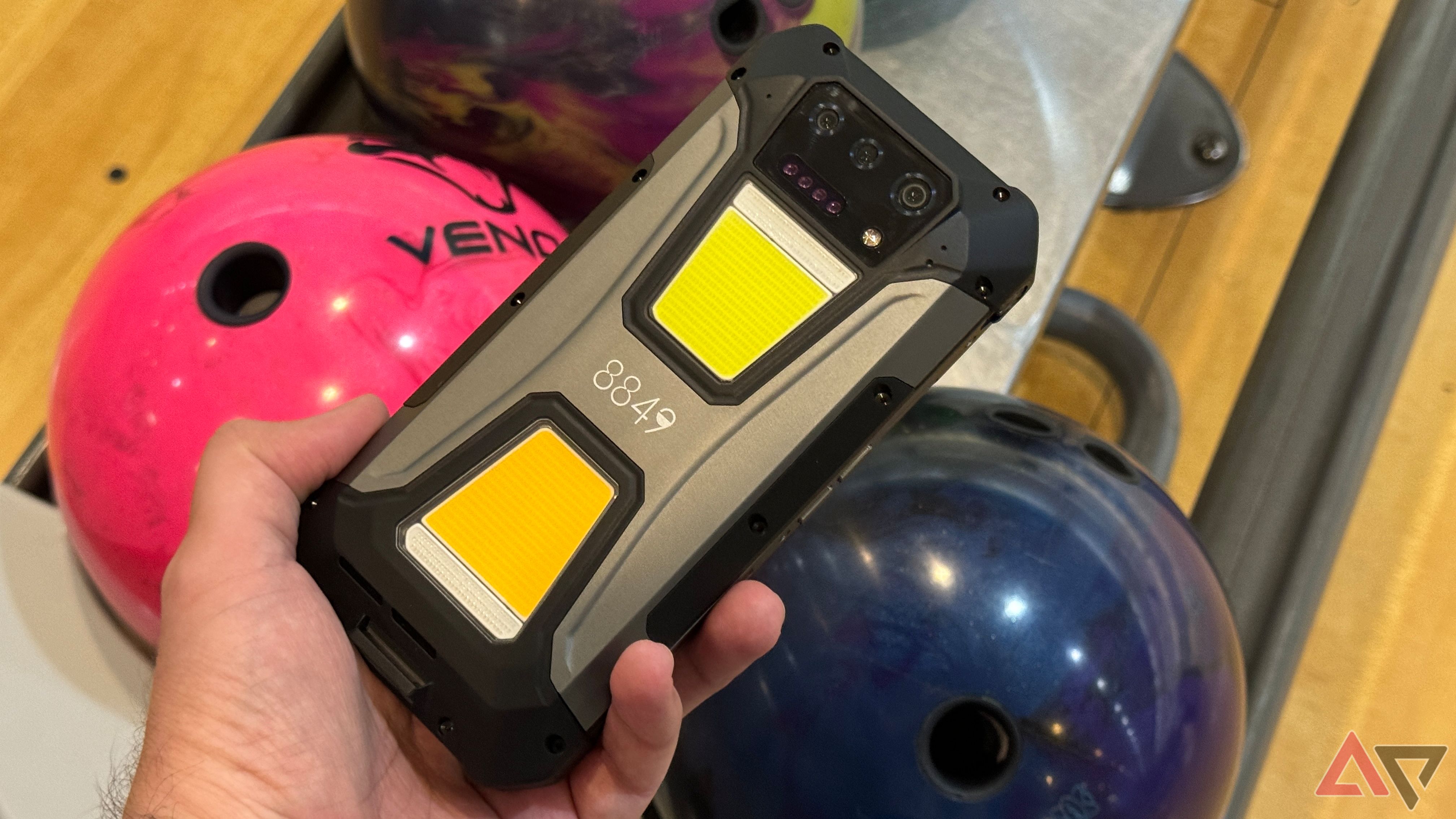 Unihertz Tank 2 Pro out at the bowling alley next to a Motiv Hyper Venom