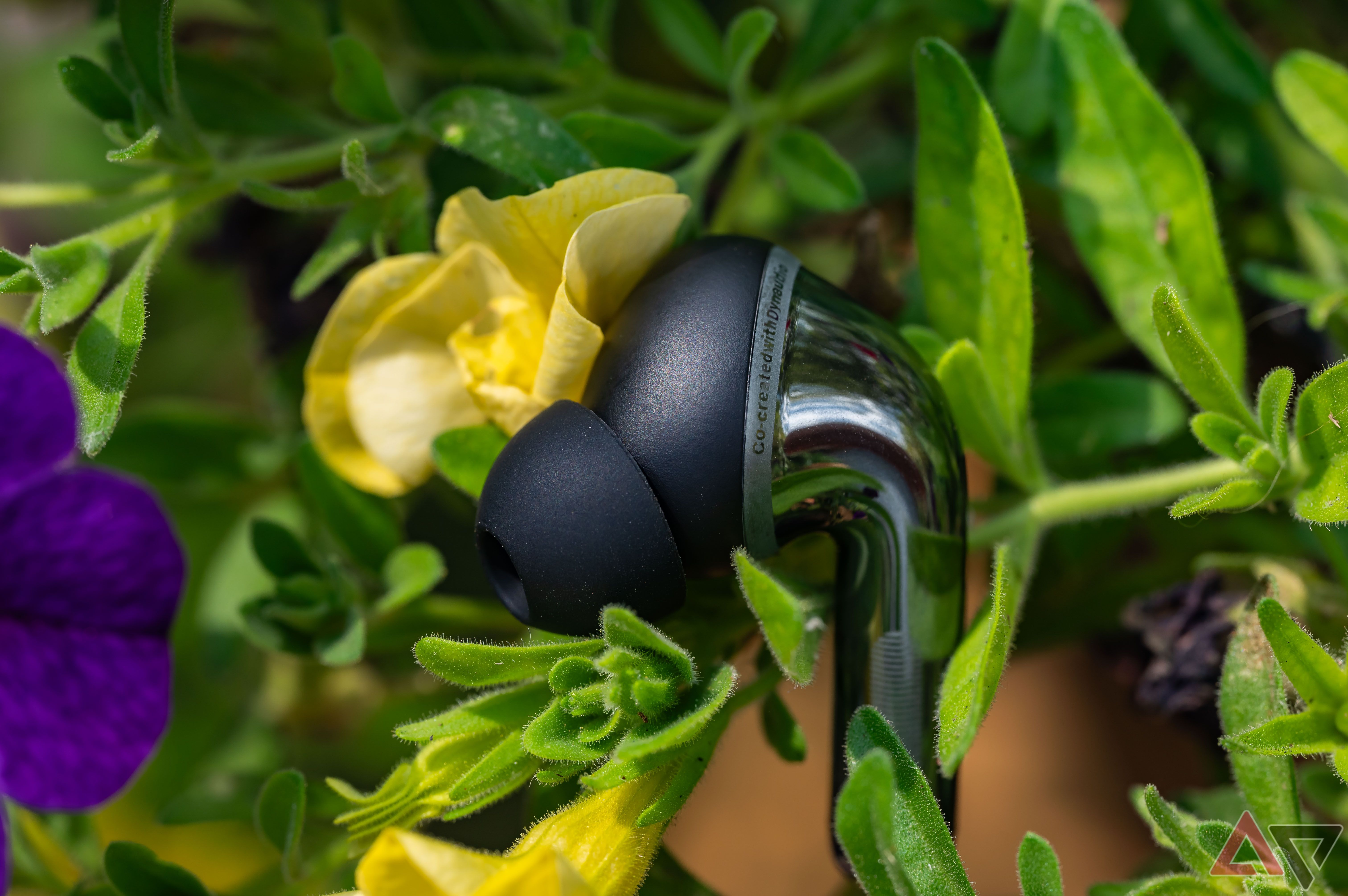 OnePlus Buds Pro 3 earbud among flowers