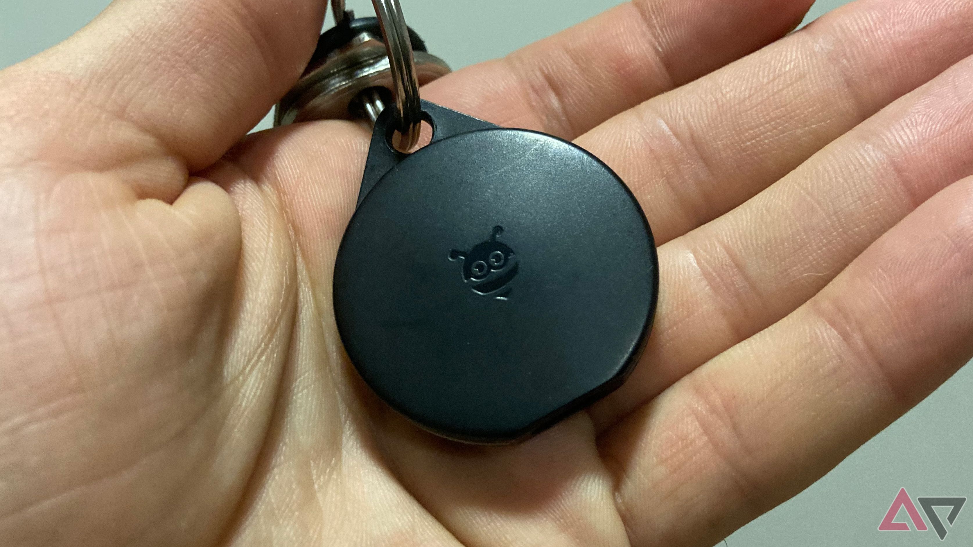 The Pebblebee Clip for Android held in a hand