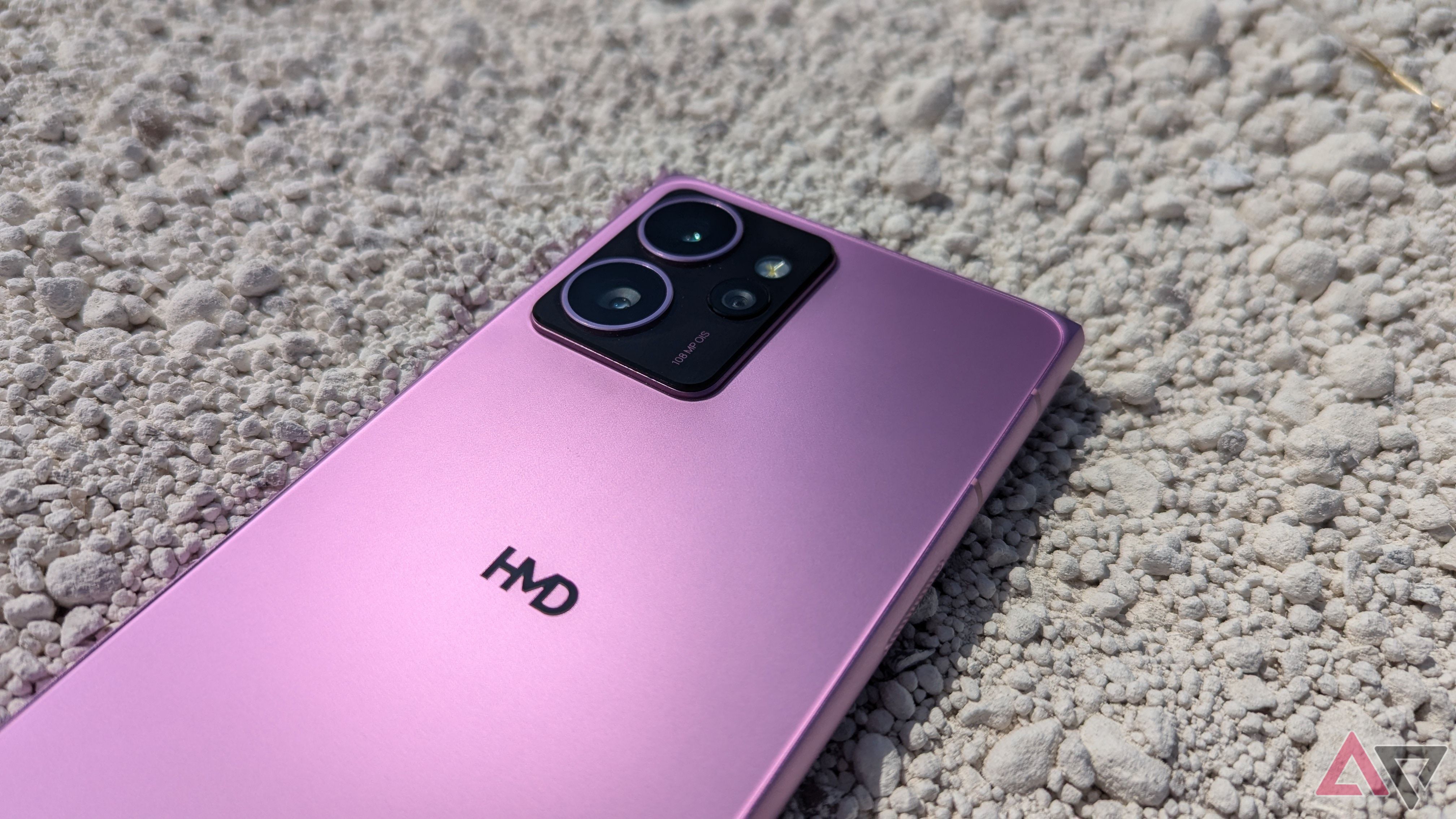 HMD Skyline on white gravel showing back cover and camera lenses 