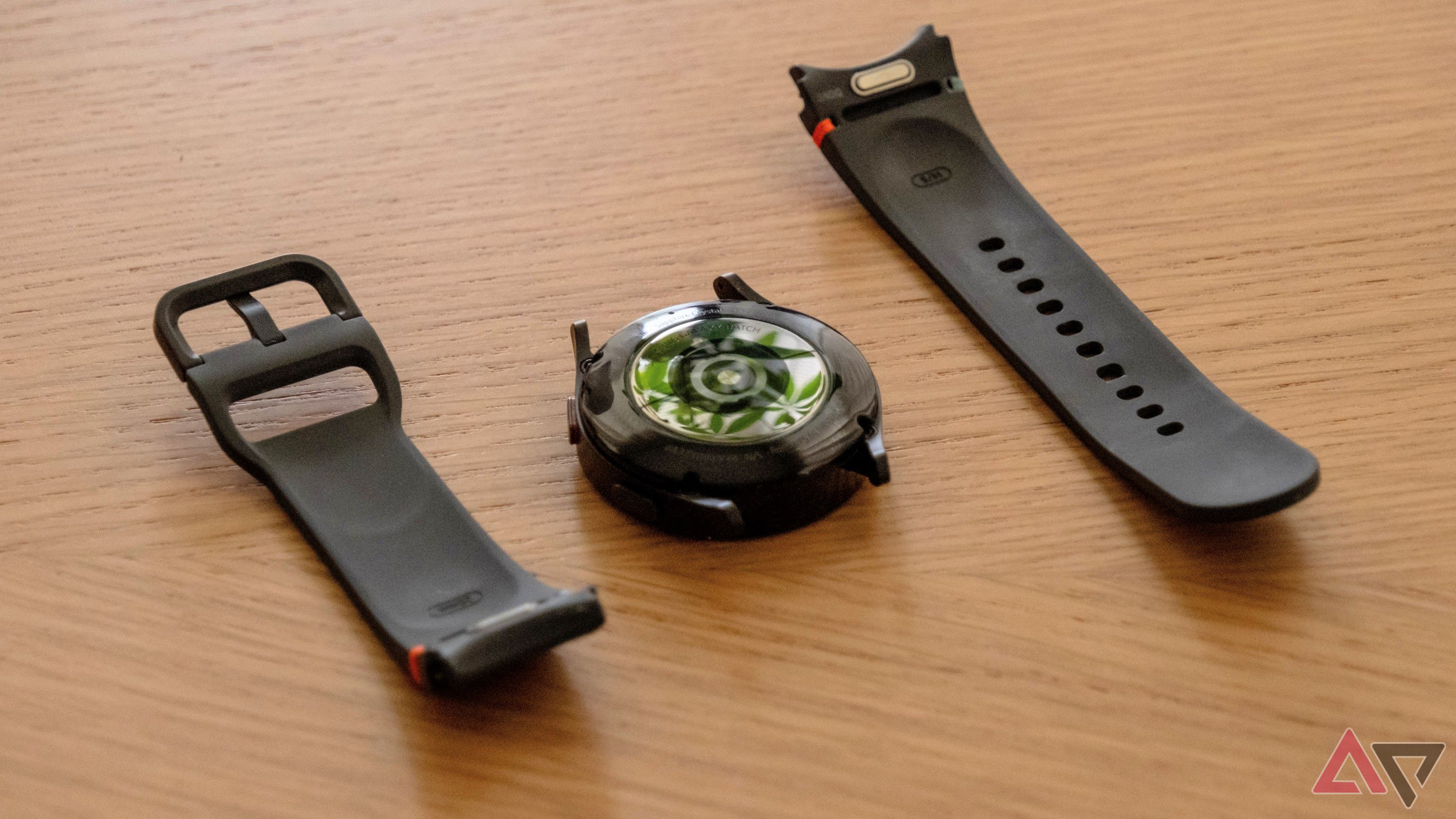 The Samsung Galaxy Watch FE, face down, with its band removed.