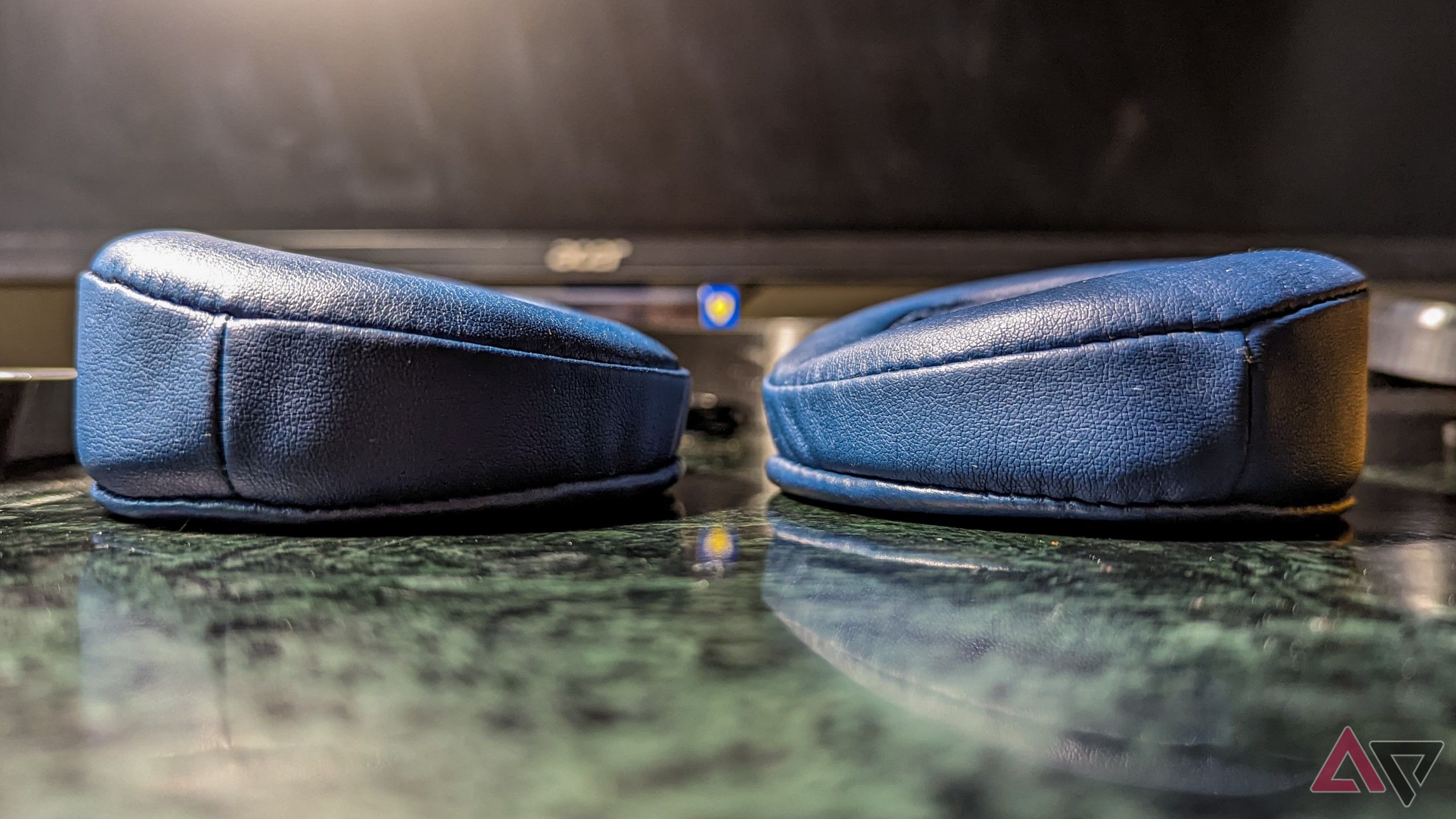 side profile shot of the blue PU earpads showing their angle 