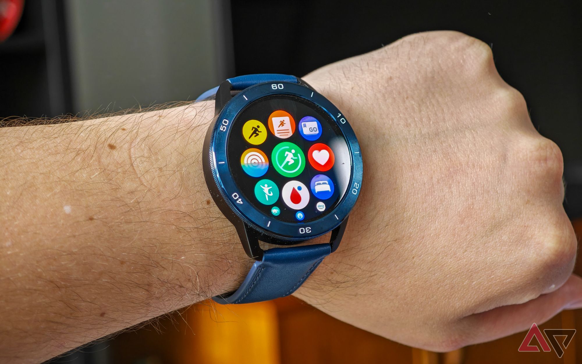 Xiaomi Watch S3 on a man's wrist showing the app drawer