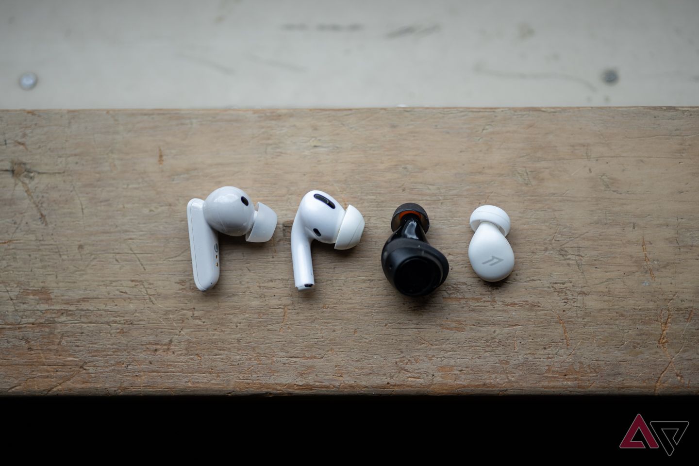 A row of four headphones from various brands and sizes