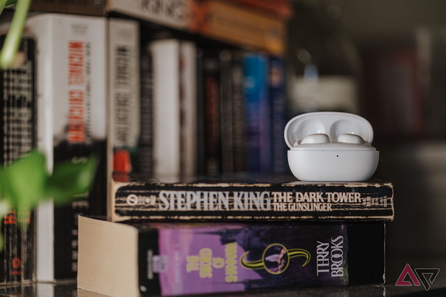 1more z30 sleeping ear headphone sitting on books