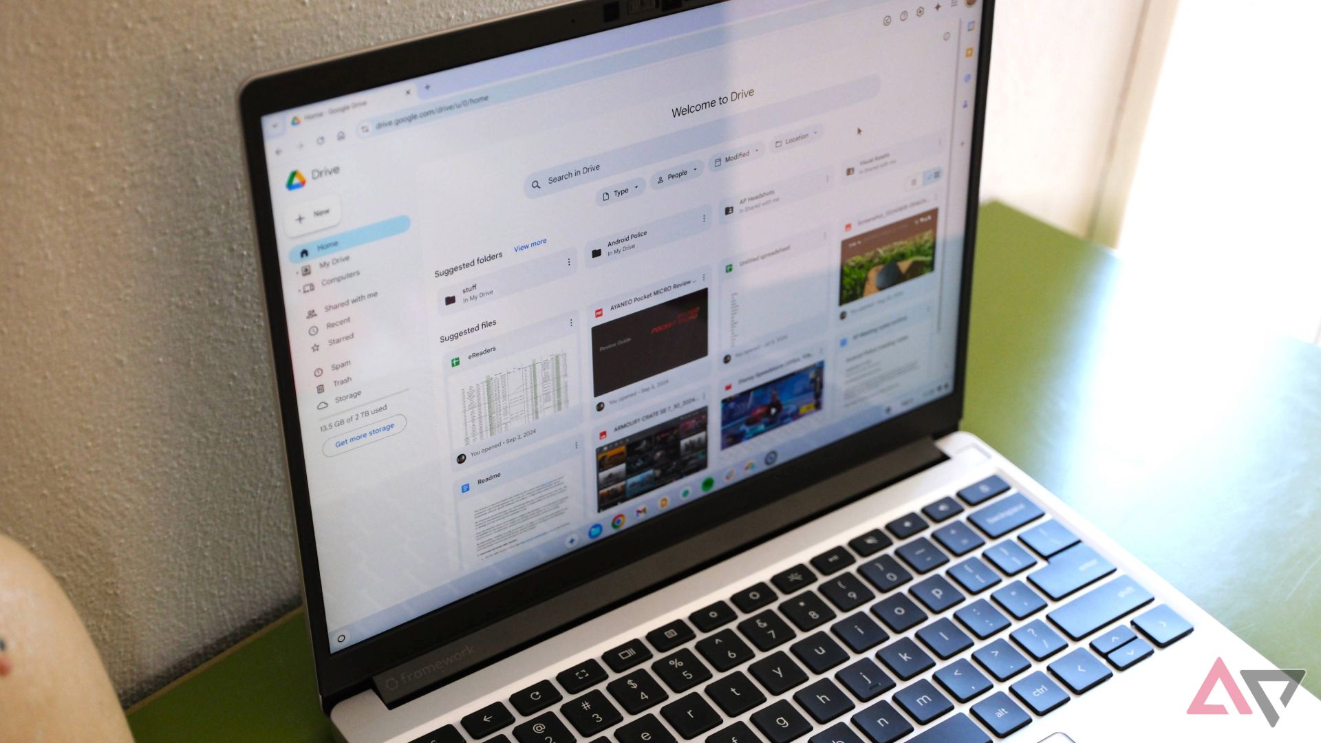 Google Drive homepage opens on a Windows laptop on a green desk