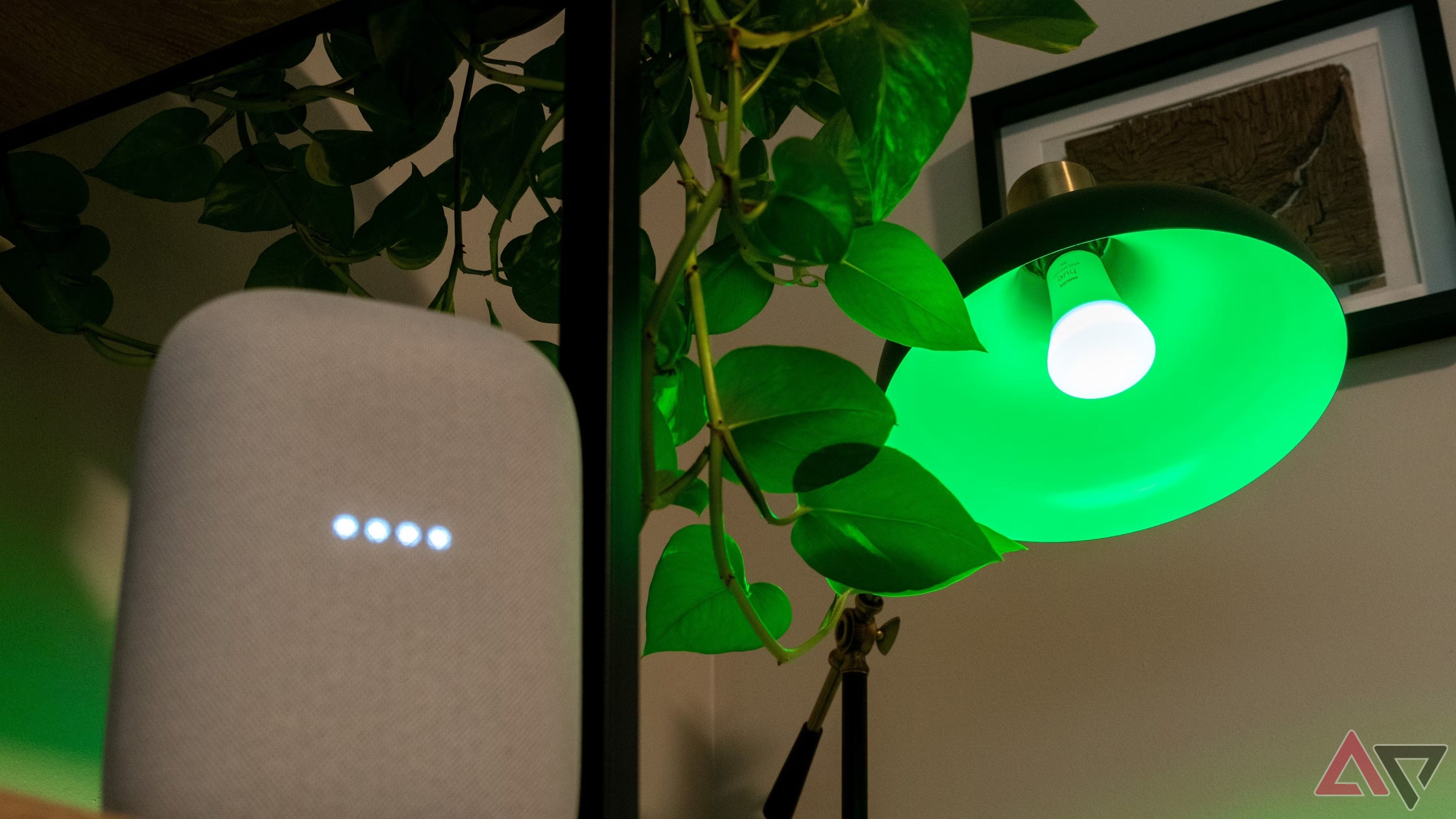 The Google Nest Audio speaker and a green smart light