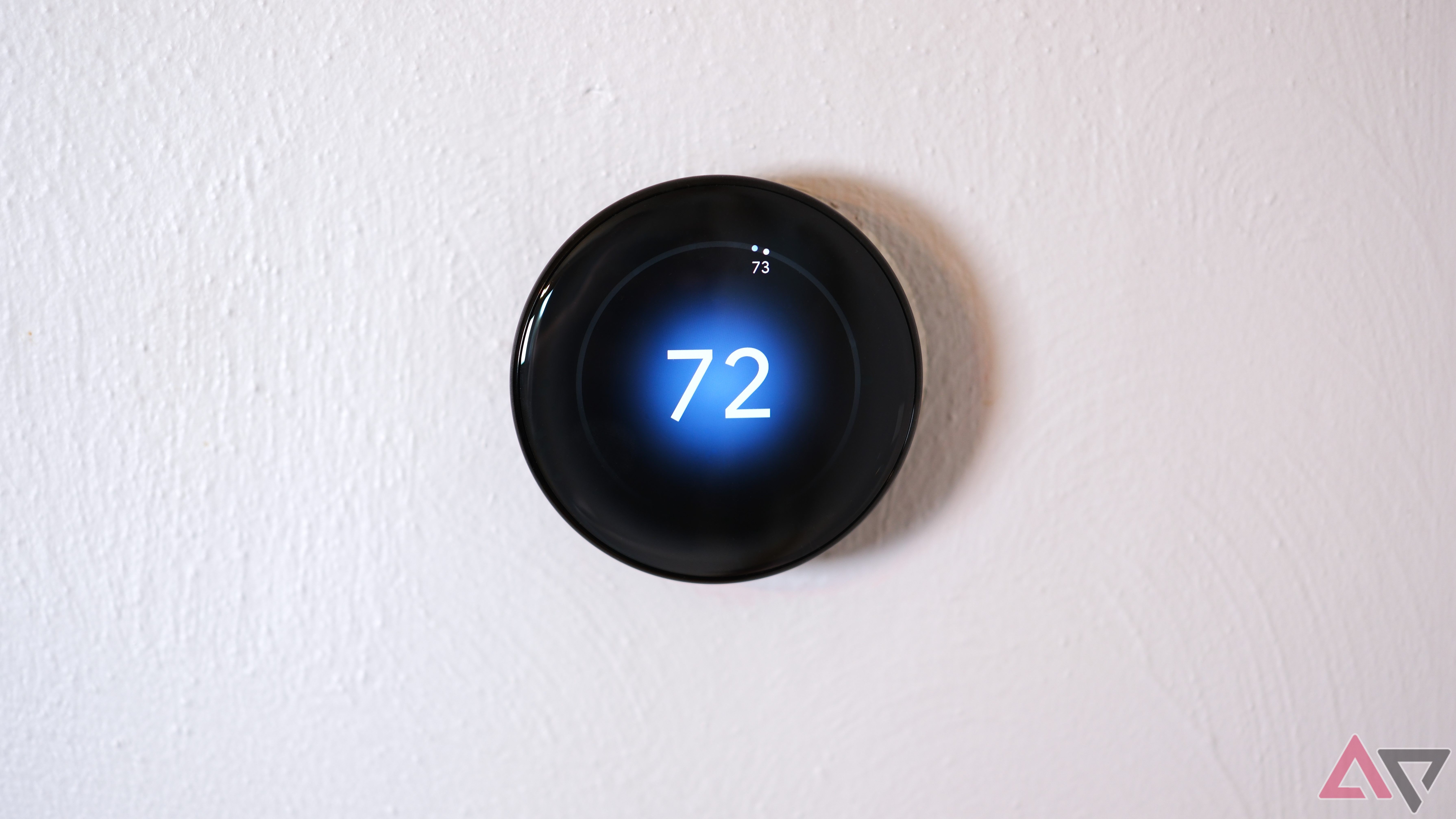 Google Nest Learning Thermostat (4th gen) showing face straight on with temperature