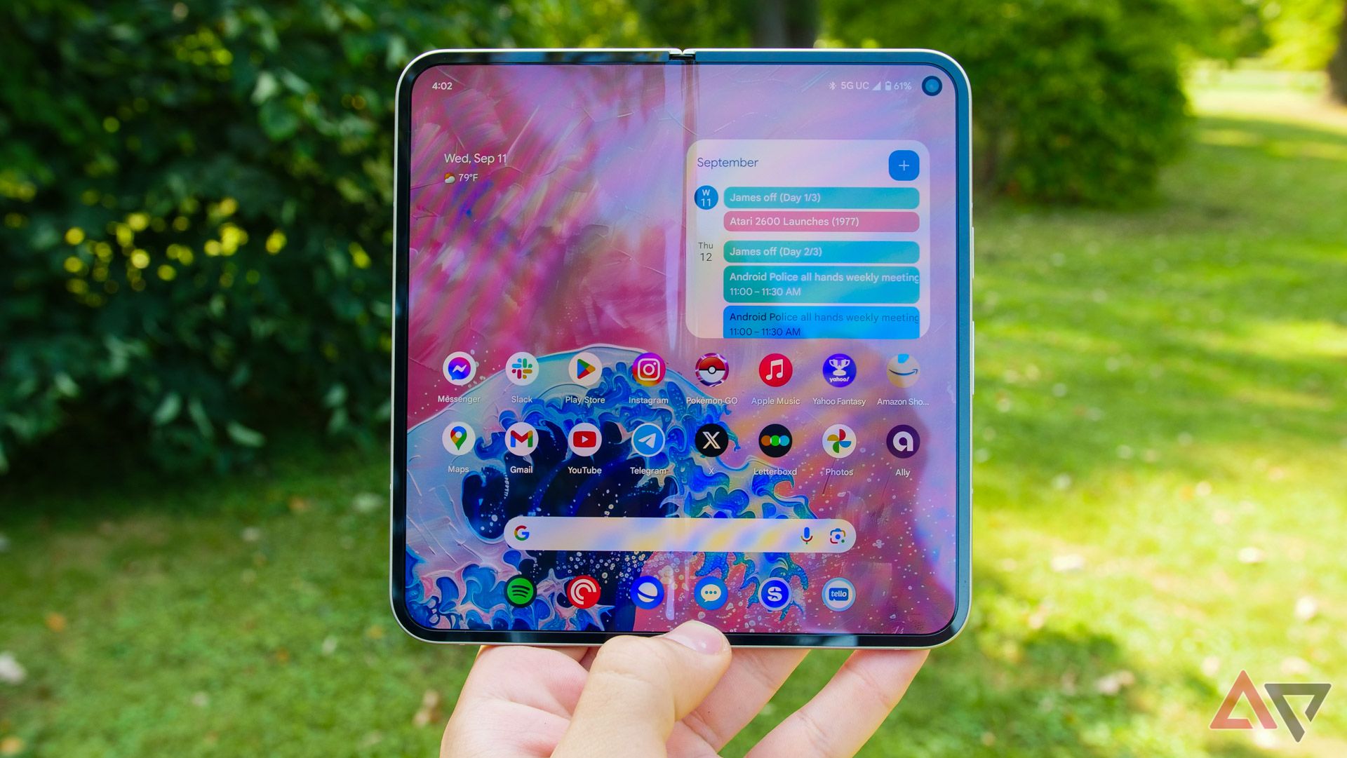 The hand holding the Pixel 9 Pro Fold on the outside has a large display.