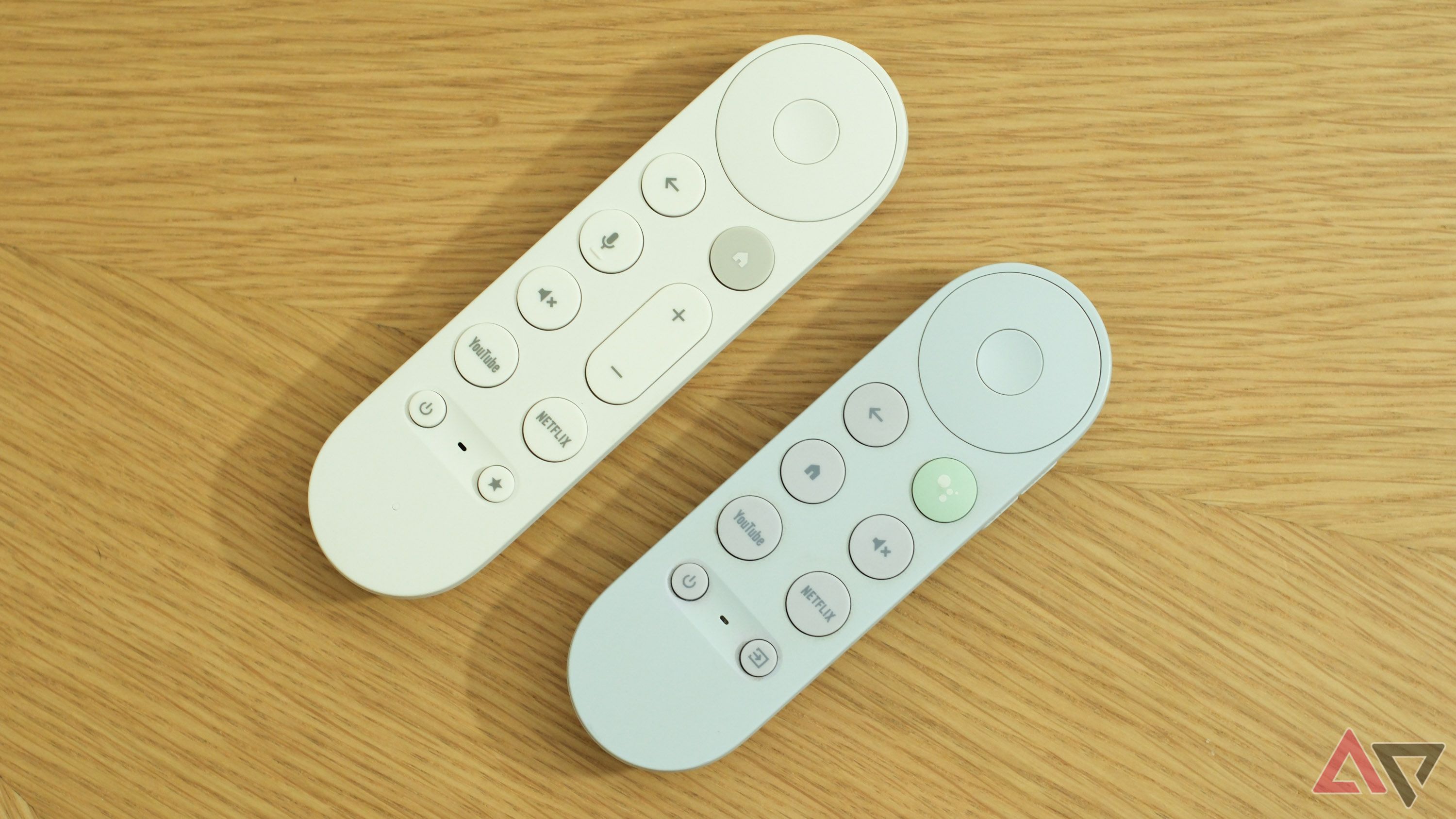 The Google TV Streamer's remote next to the Chromecast with Google TV's remote.