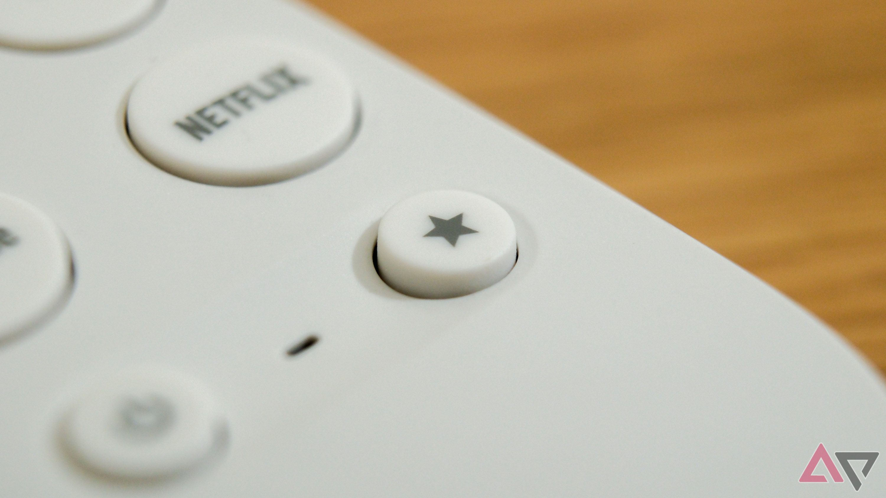 A Google TV Streamer highlighting the customizable button