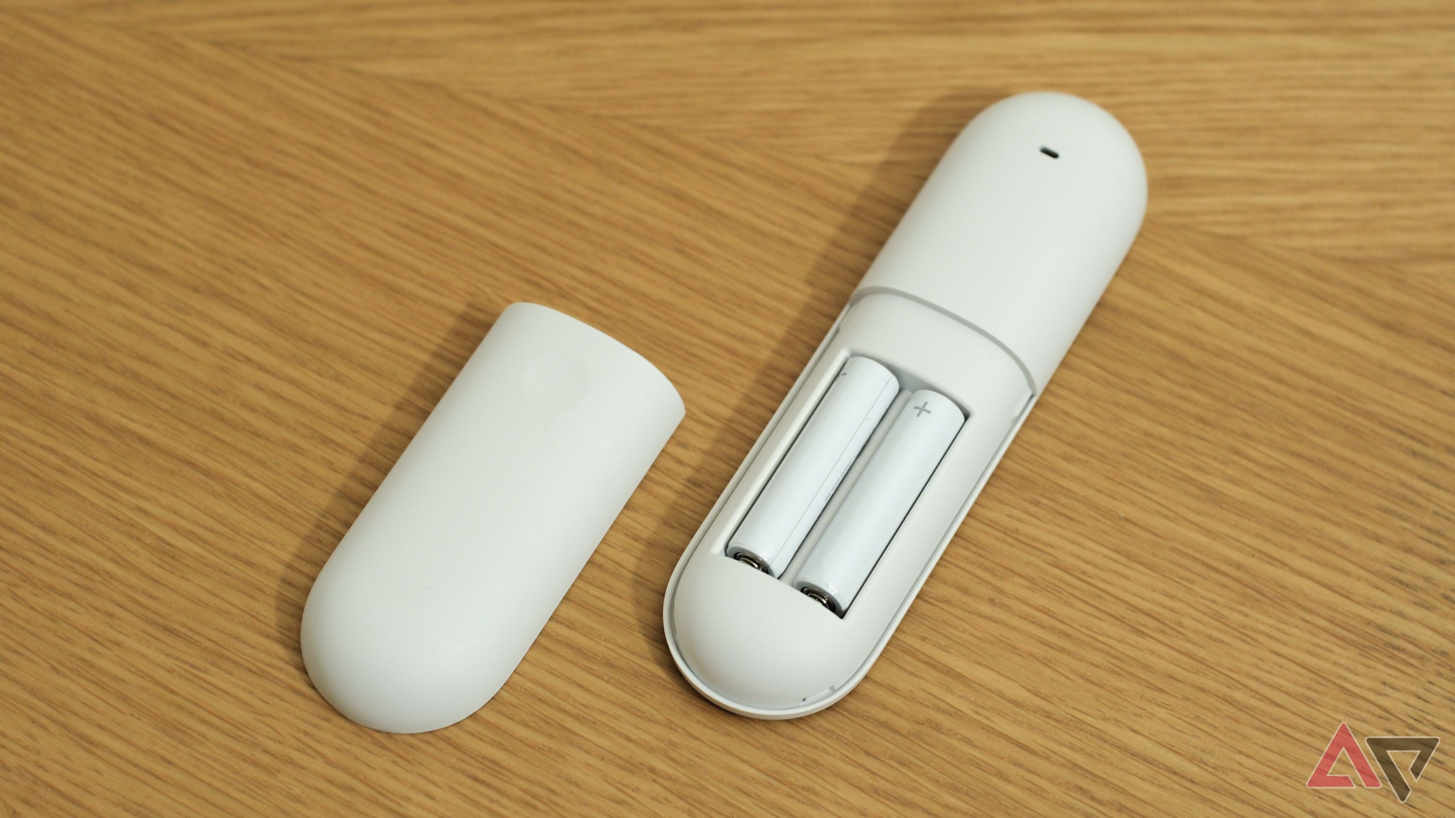 The Google TV Streamer remote's battery compartment.