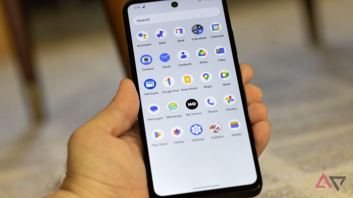 A hand holding the HMD Vibe showing the apps