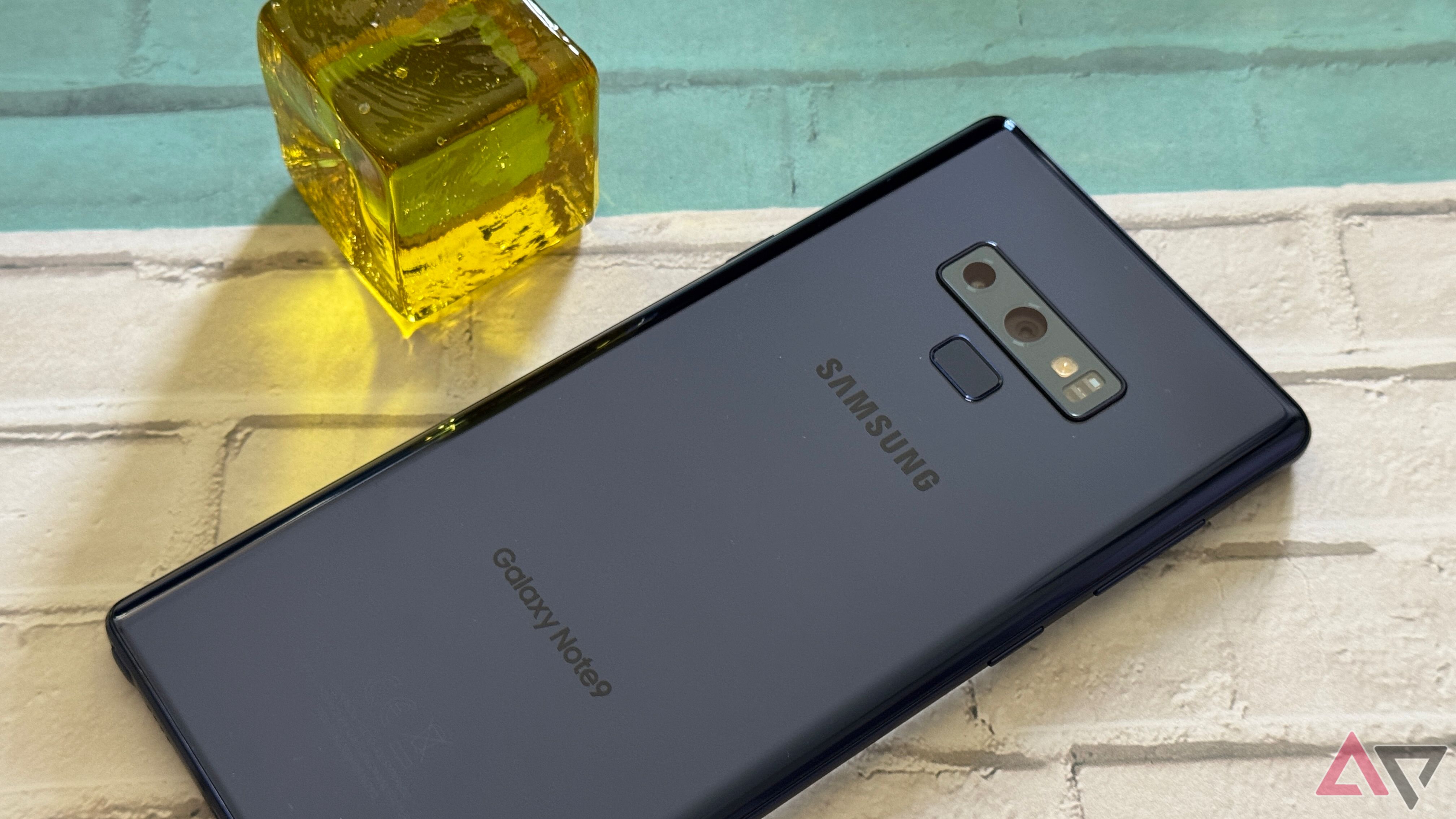 Samsung Galaxy Note 9 next to glass block