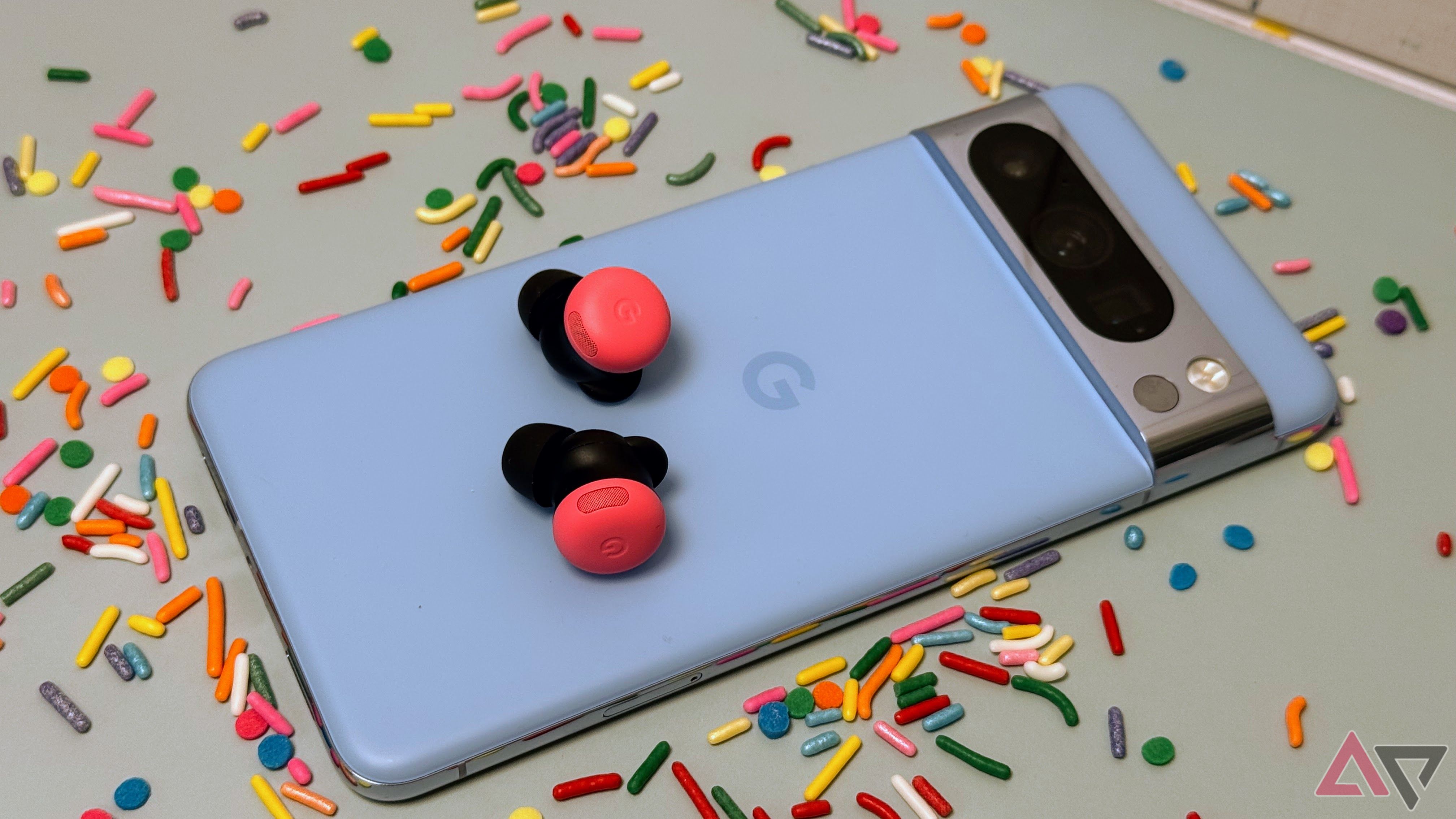 Google Pixel Buds Pro 2 set on Pixel 8 Pro phone surrounded by sprinkles