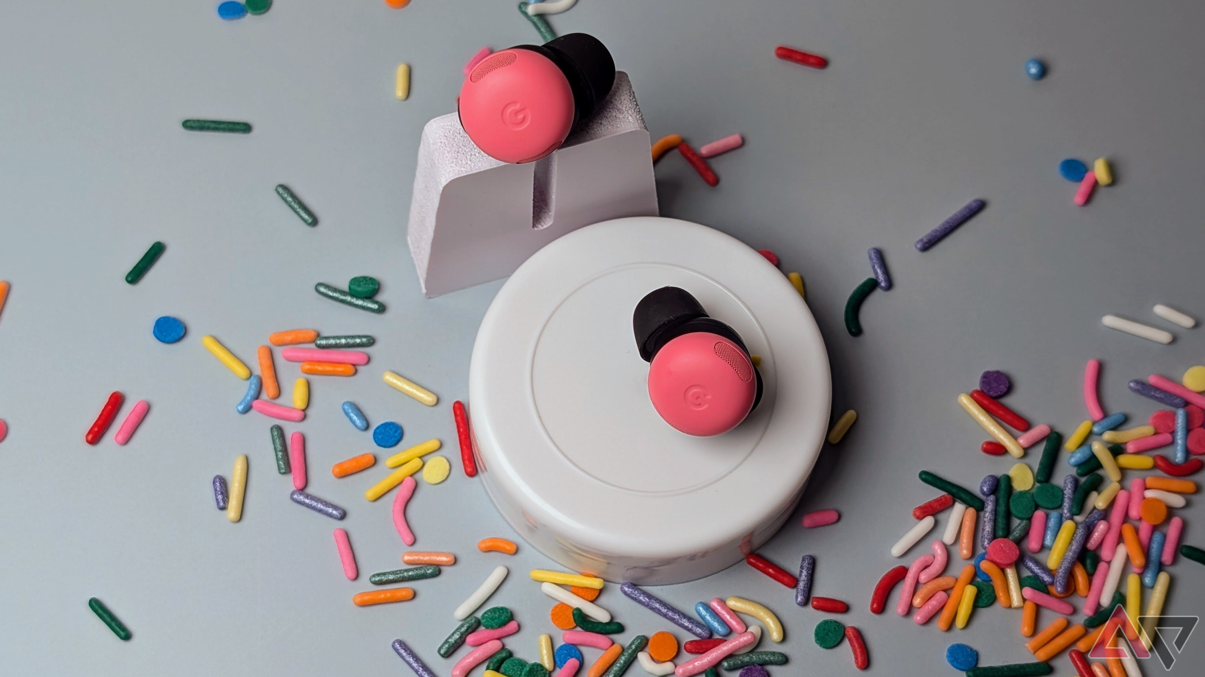 Peony Pixel Buds Pro 2 set on white stones surrounded by sprinkles