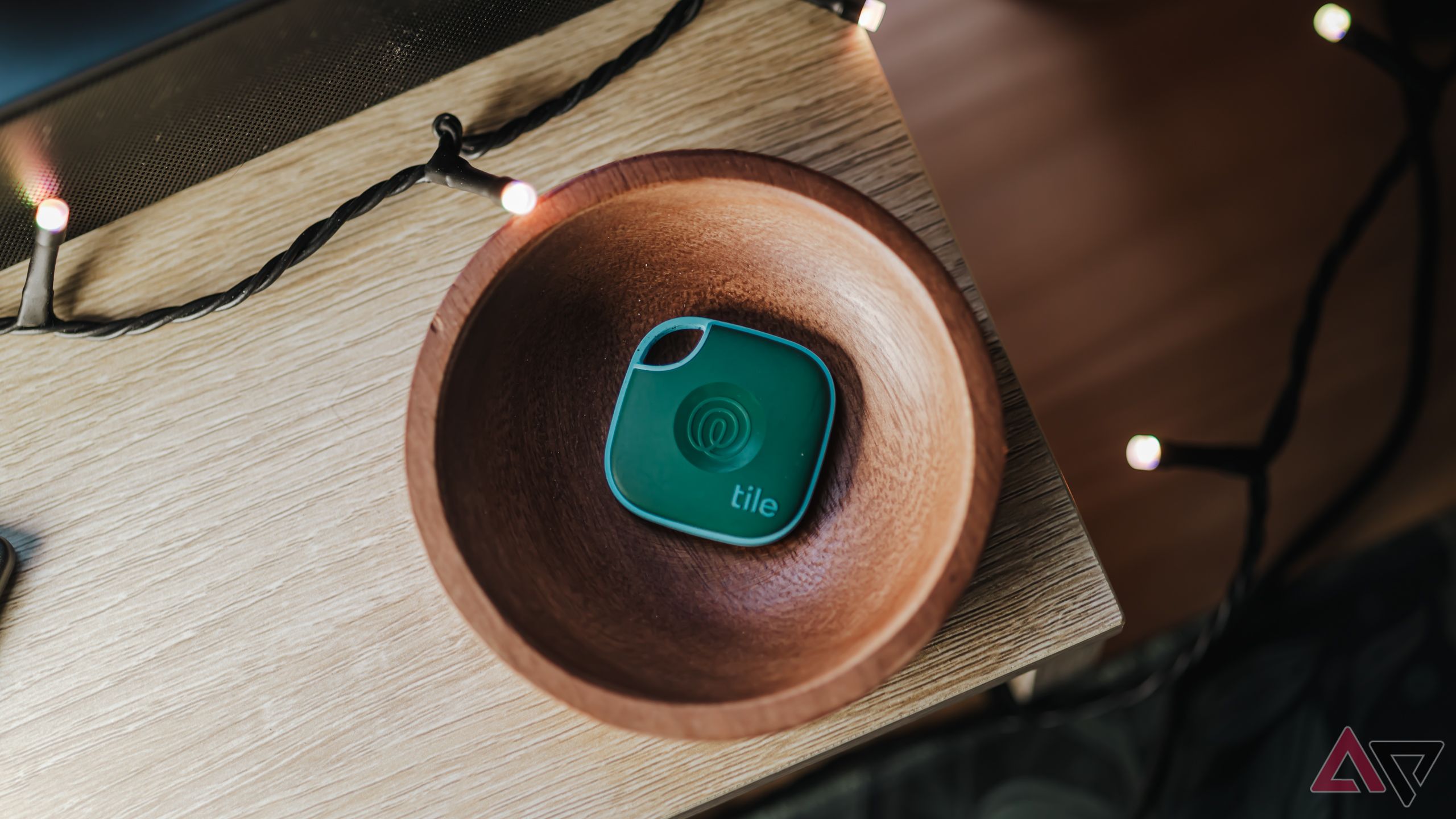 Tile Mate 2024 in green sitting in wooden dish